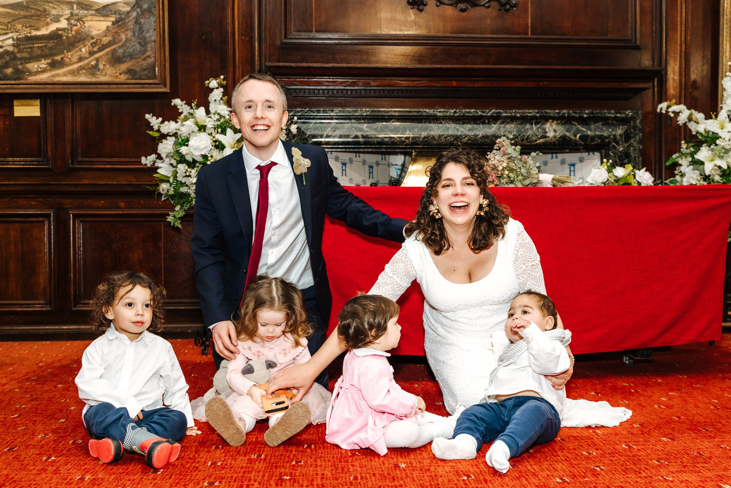 Groom and Bride posing with young family members after their civil wedding ceremony.