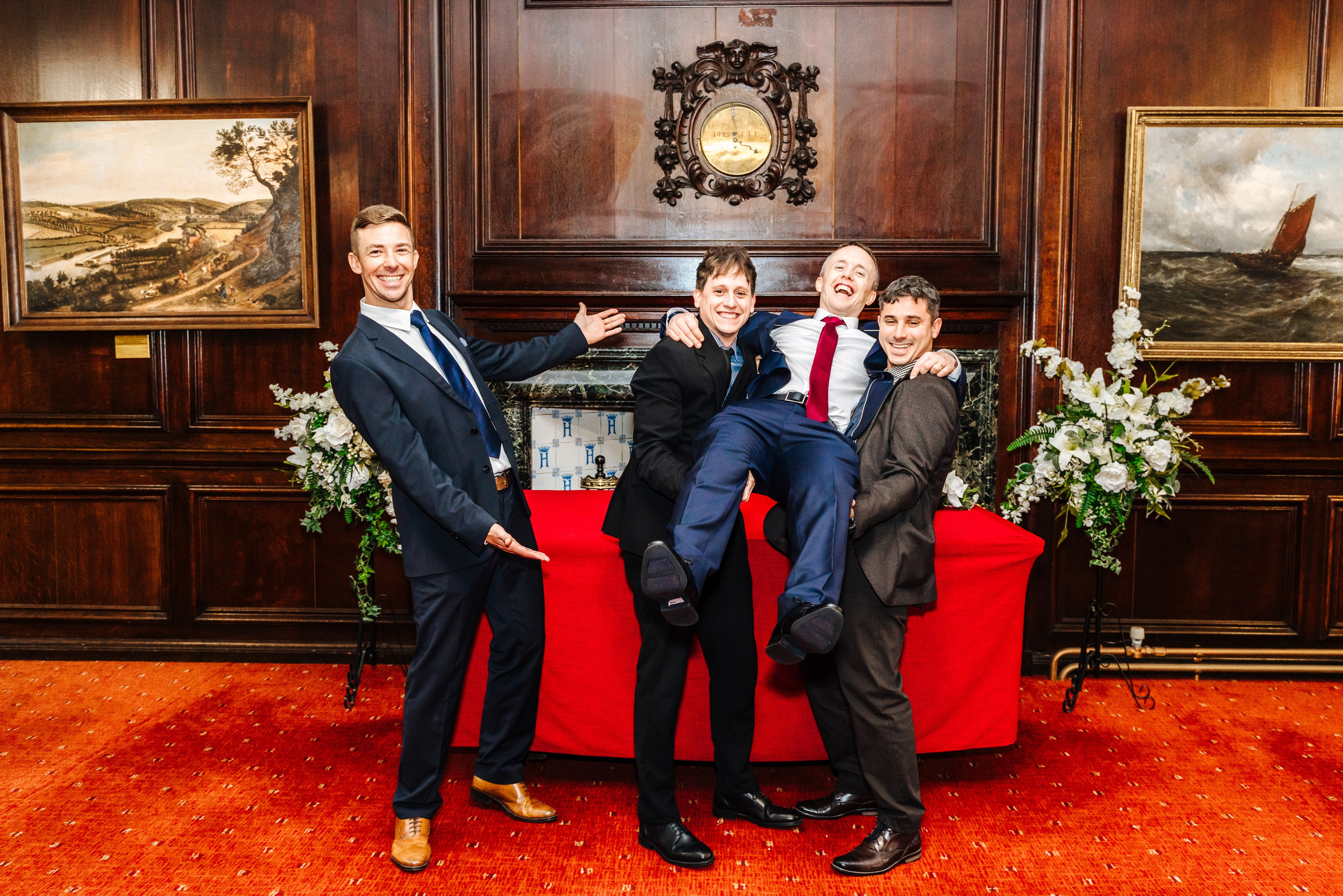 Groom posing with friends after his wedding ceremony in Henley-on-Thames.