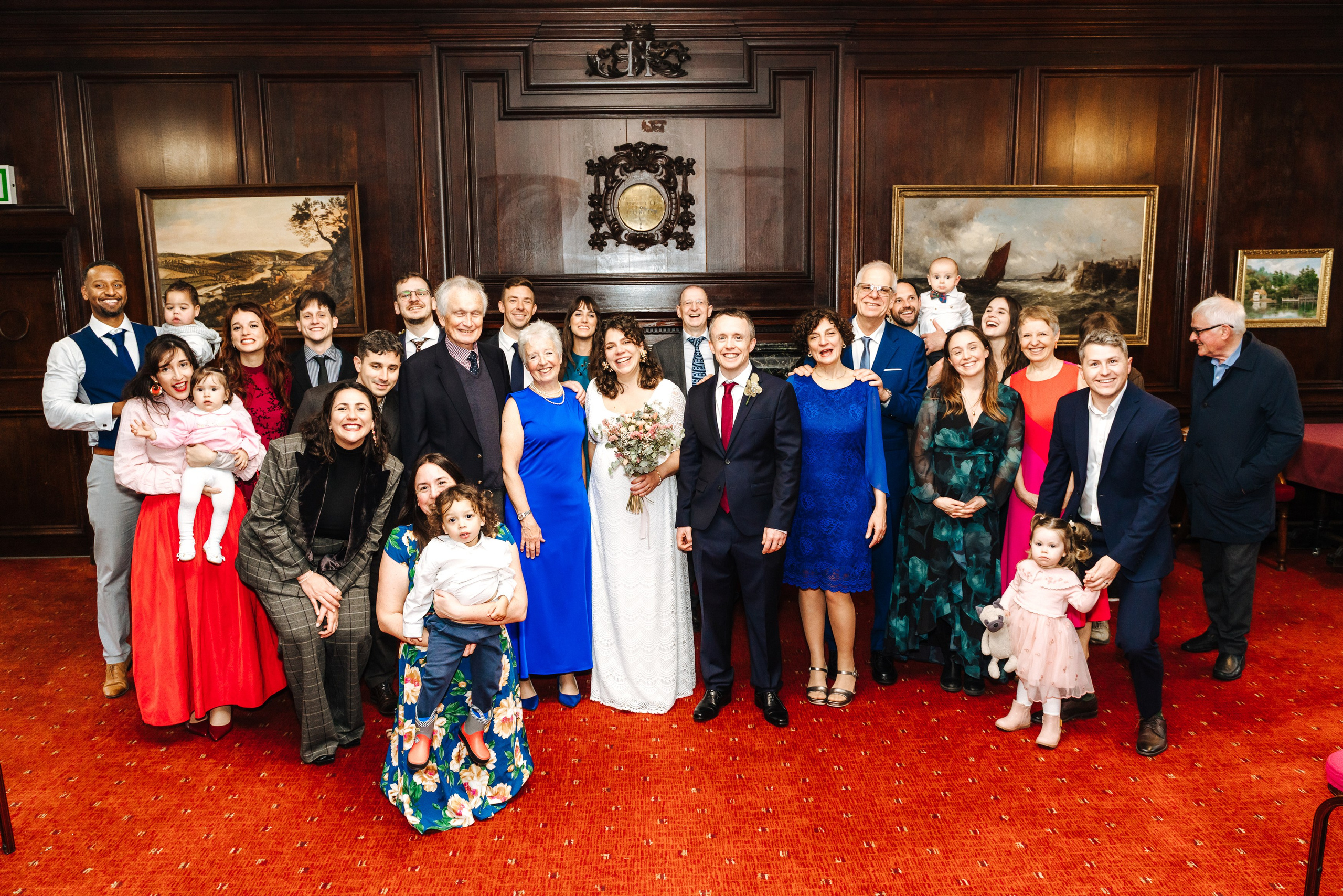 Groom and Bride's wedding guests gathered inside Henley-on-Thames Town Hall.