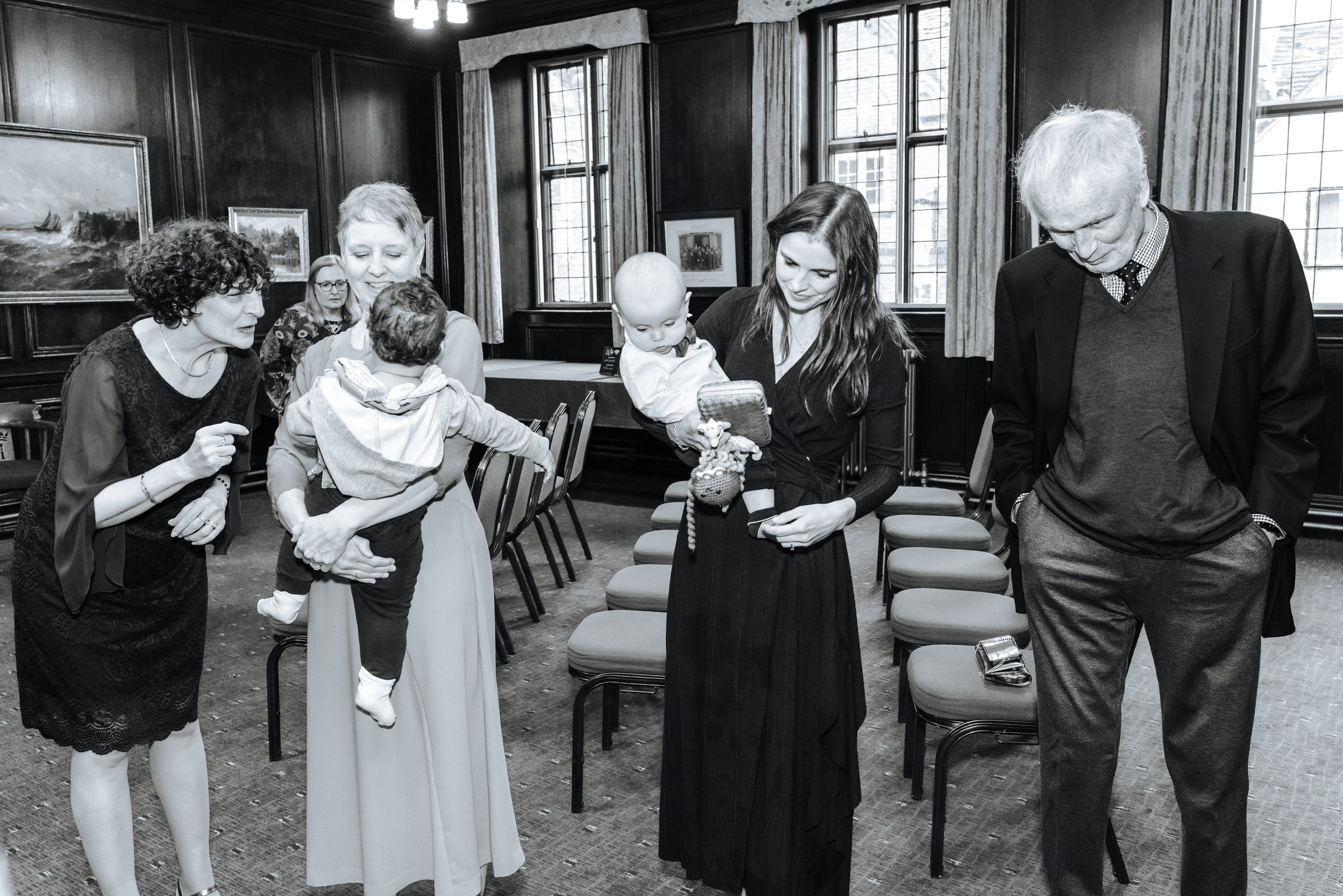 A candid moment with family and children during Peter and Virginia's wedding celebration in Henley-on-Thames.