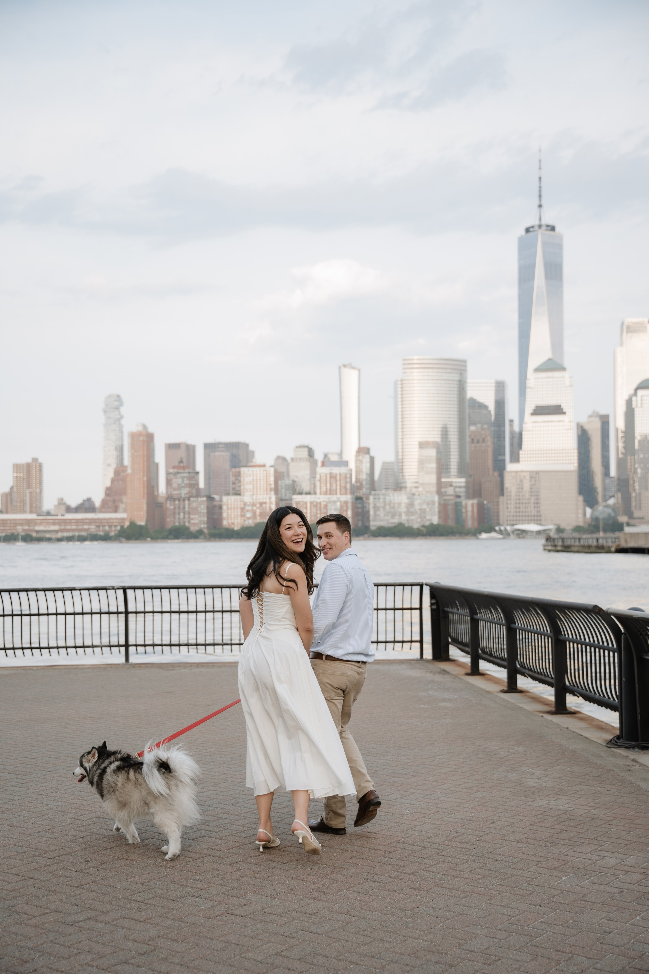 An adorable couple with their dog. Portrait and wedding photographer in New York