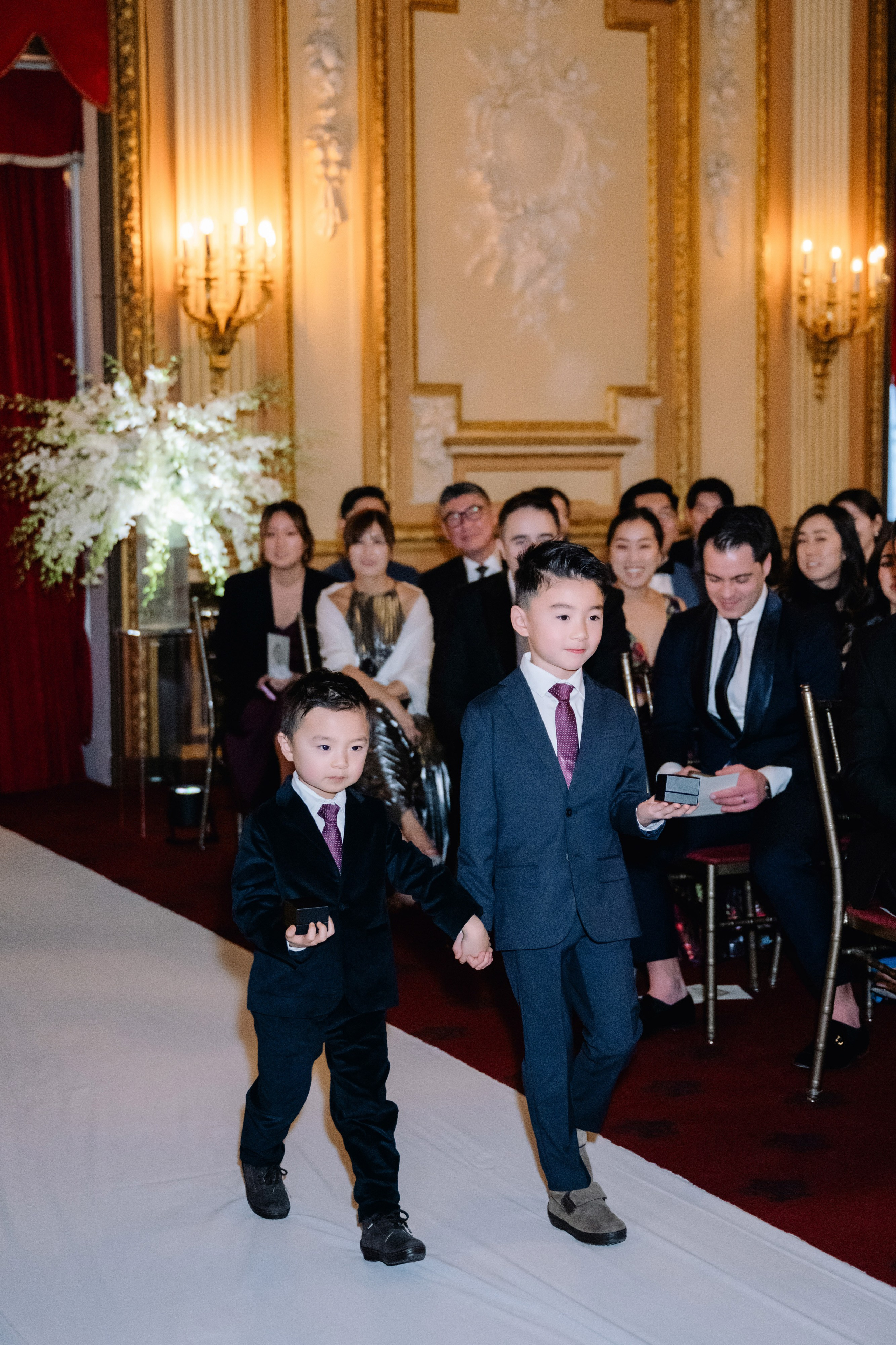 a young boy in a suit and tie