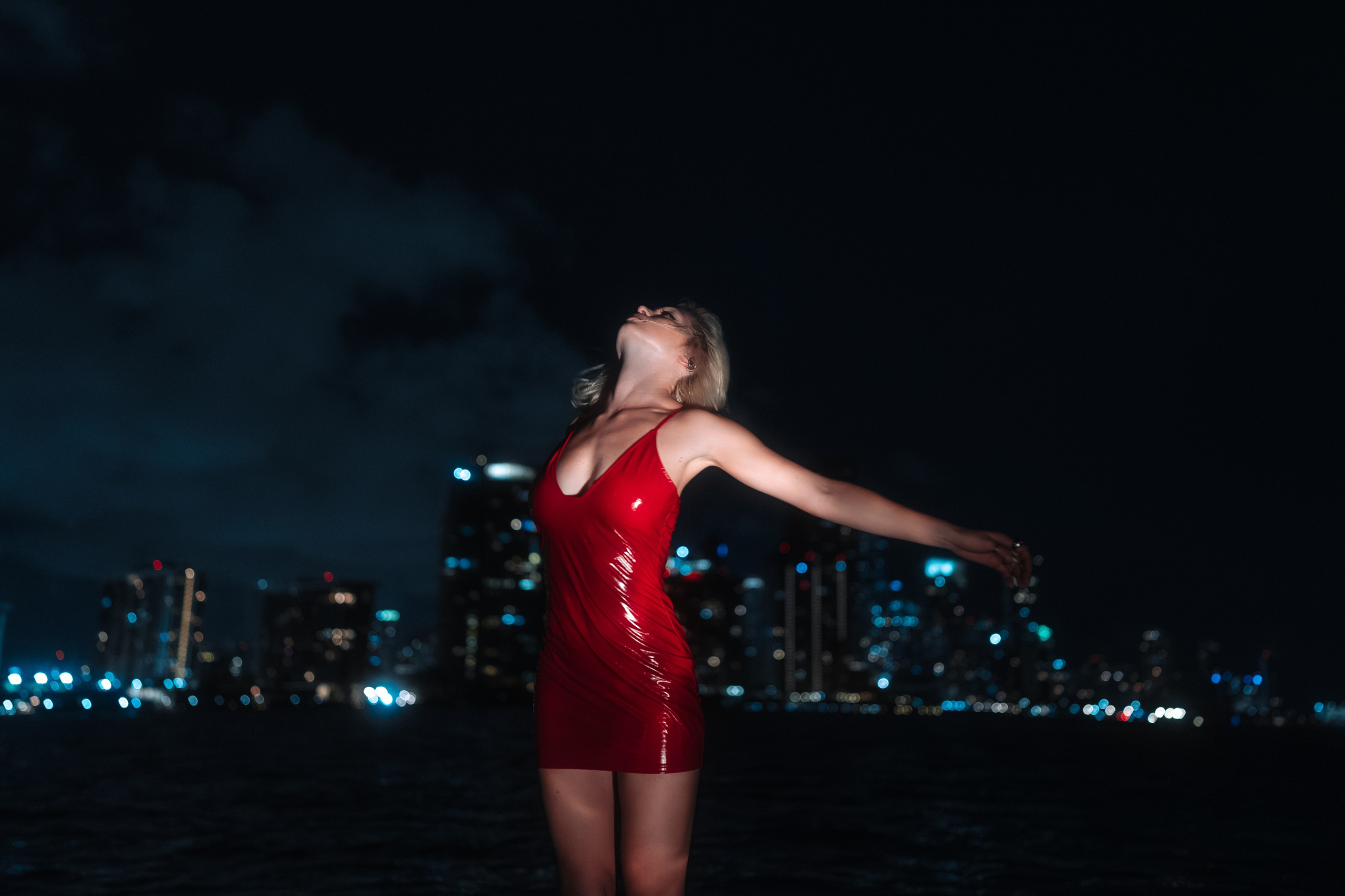 A complex night environment reduced to body, water, and light. A clean visual concept.