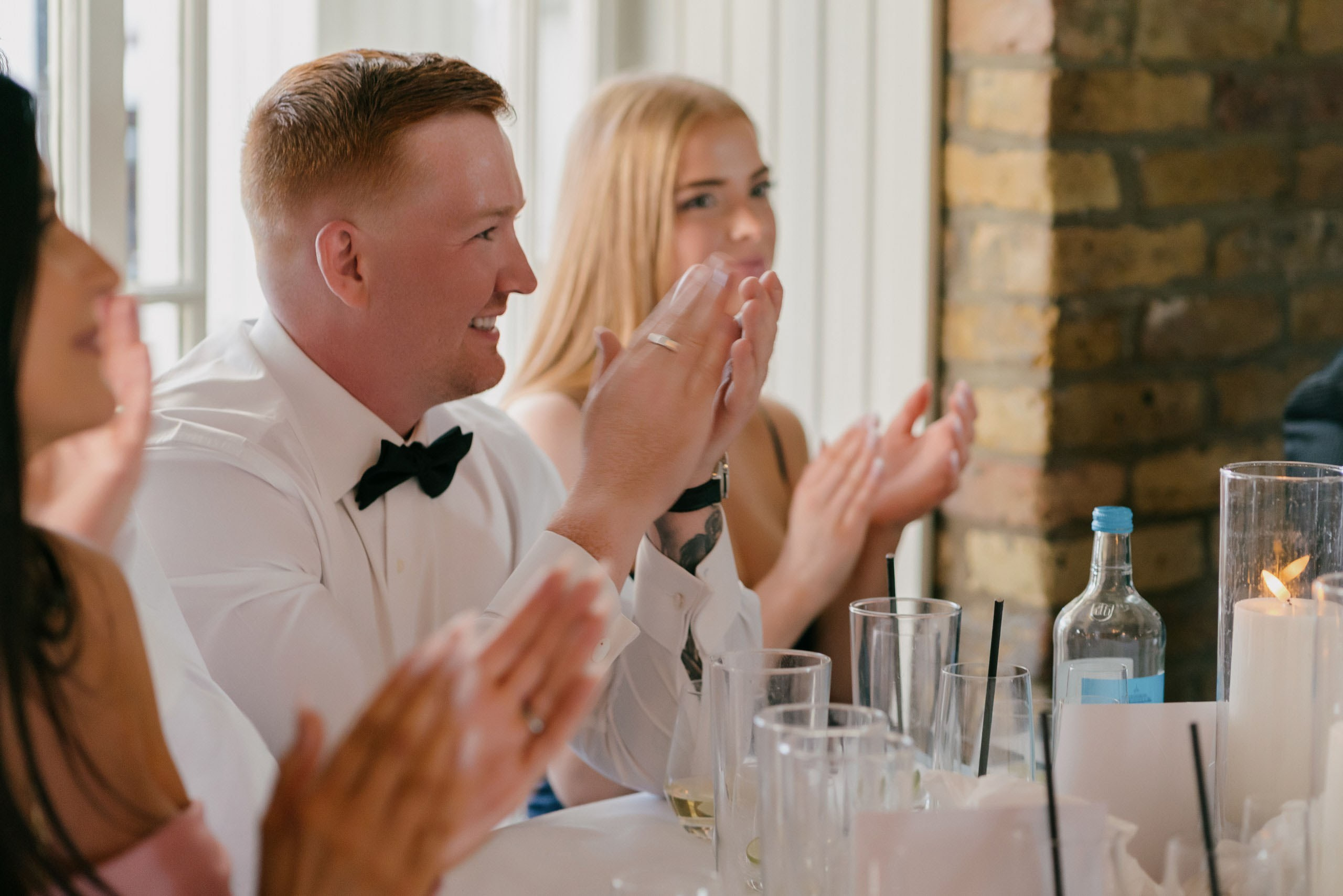 Guests applauding during wedding speeches reception Essex