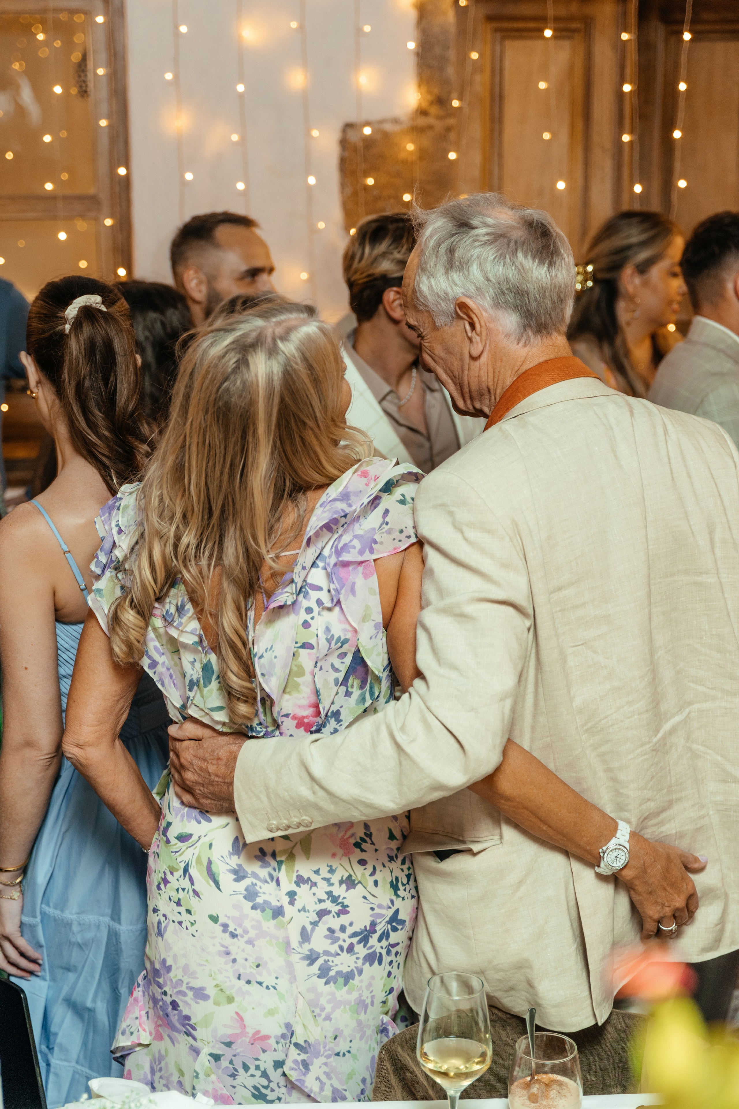 Guests enjoying traditional Greek music and dancing at the wedding party in a lively Lindos restaurant in Rhodes.