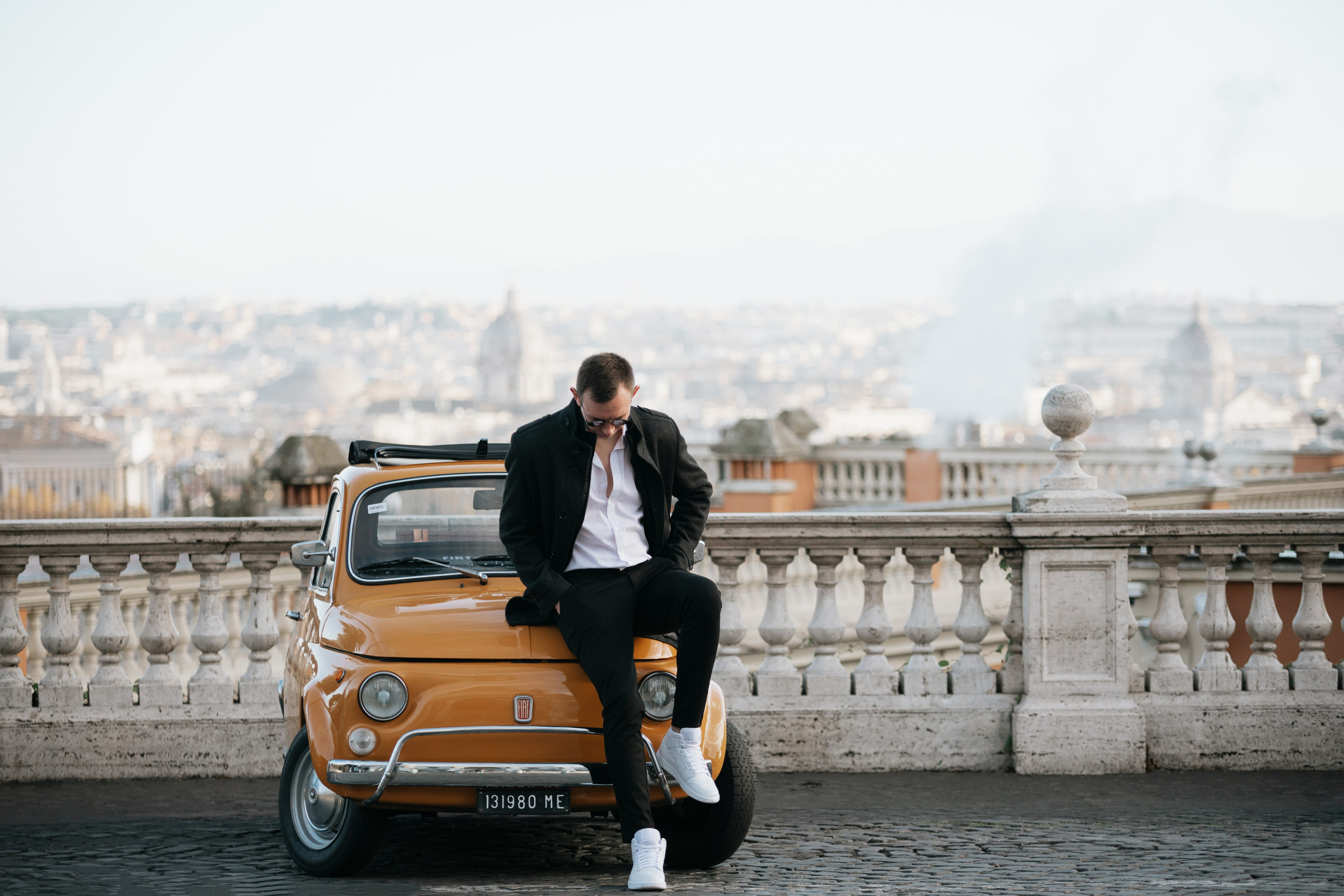 Fiat 500 and Vespa. Photographer in Rome