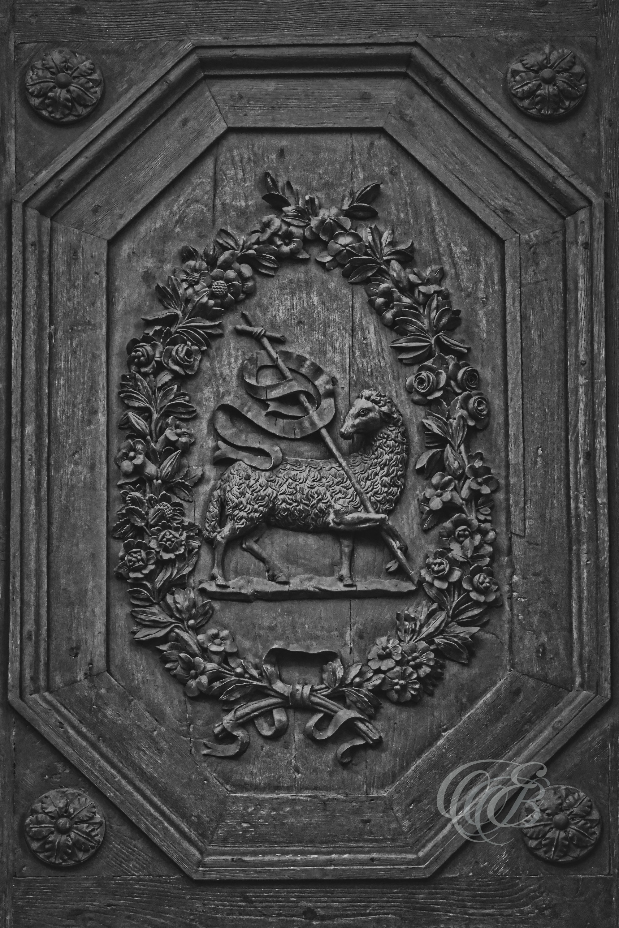 Florence Italy - Agnus Dei - B&W - Eduardo Bartoli Fine Art Photography - Black-and-white photograph of the Agnus Dei bronze symbol on a cathedral door in Florence, Italy – fine art photography by Eduardo Bartoli.