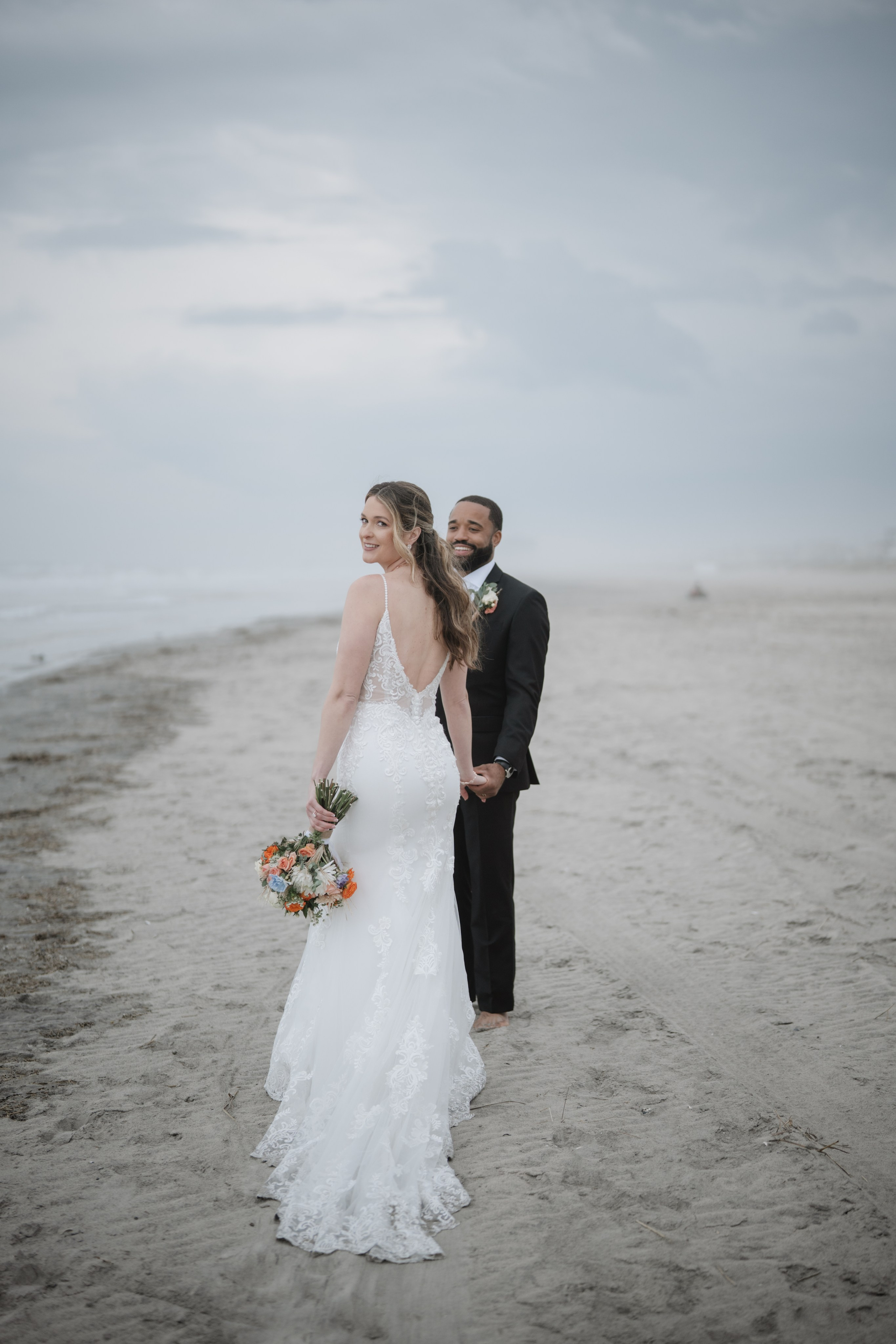 Wedding walk on the beach. Portrait and wedding photographer in New York