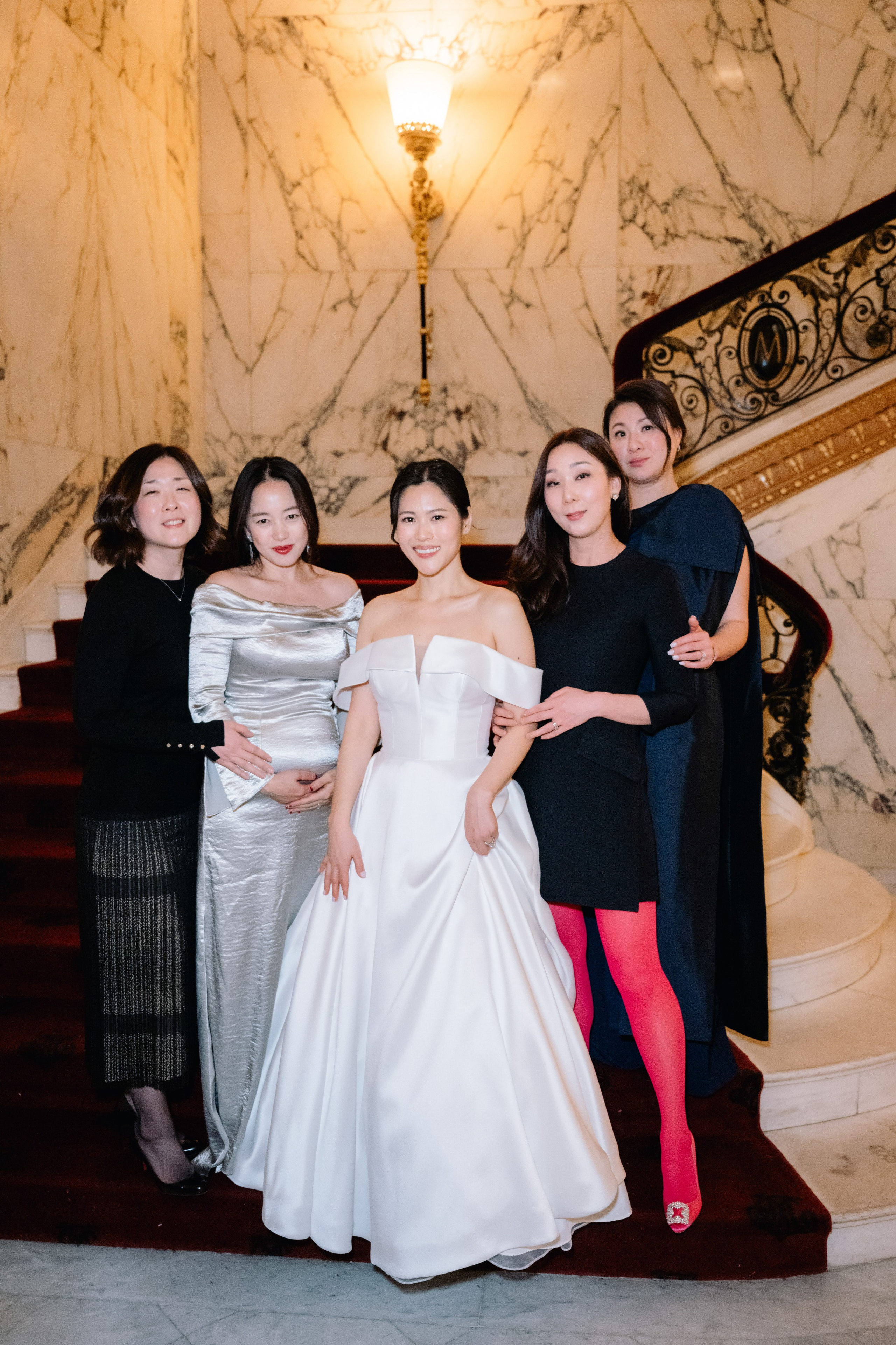 a group of women standing next to each other women