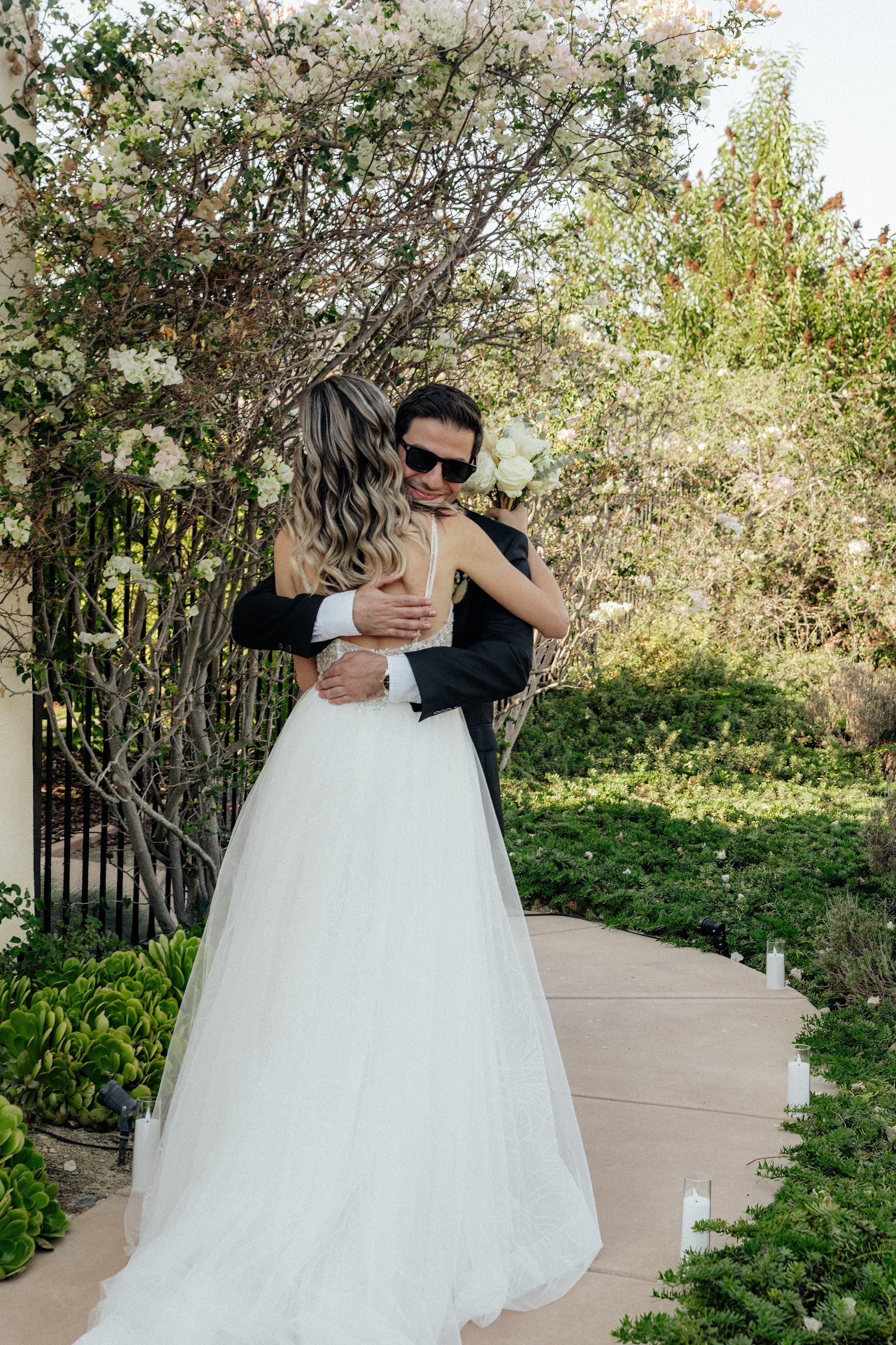 Bride and groom embracing after first look during wedding session in Chicago