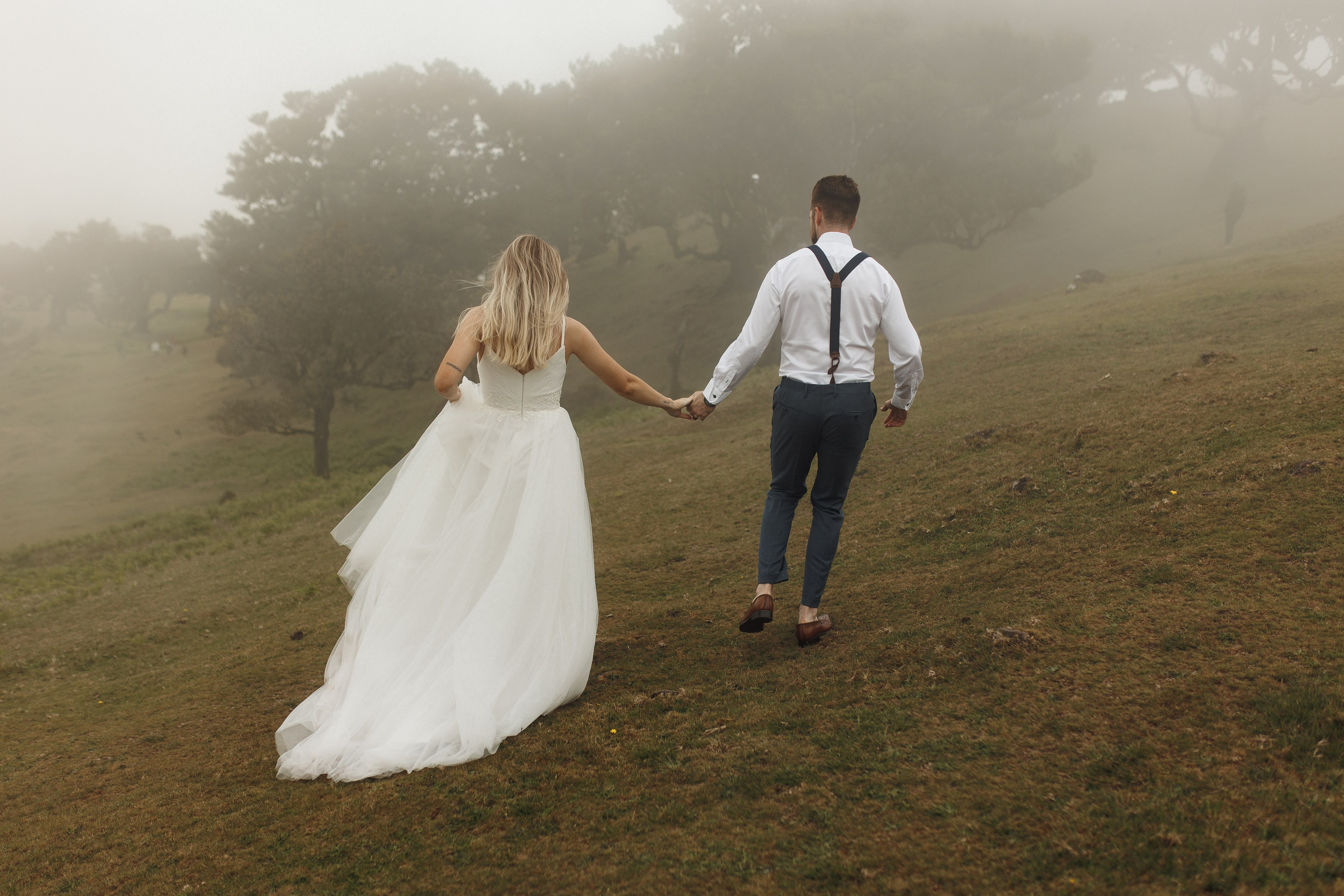 Bride and groom's romantic walk in Fanal Forest Madeira