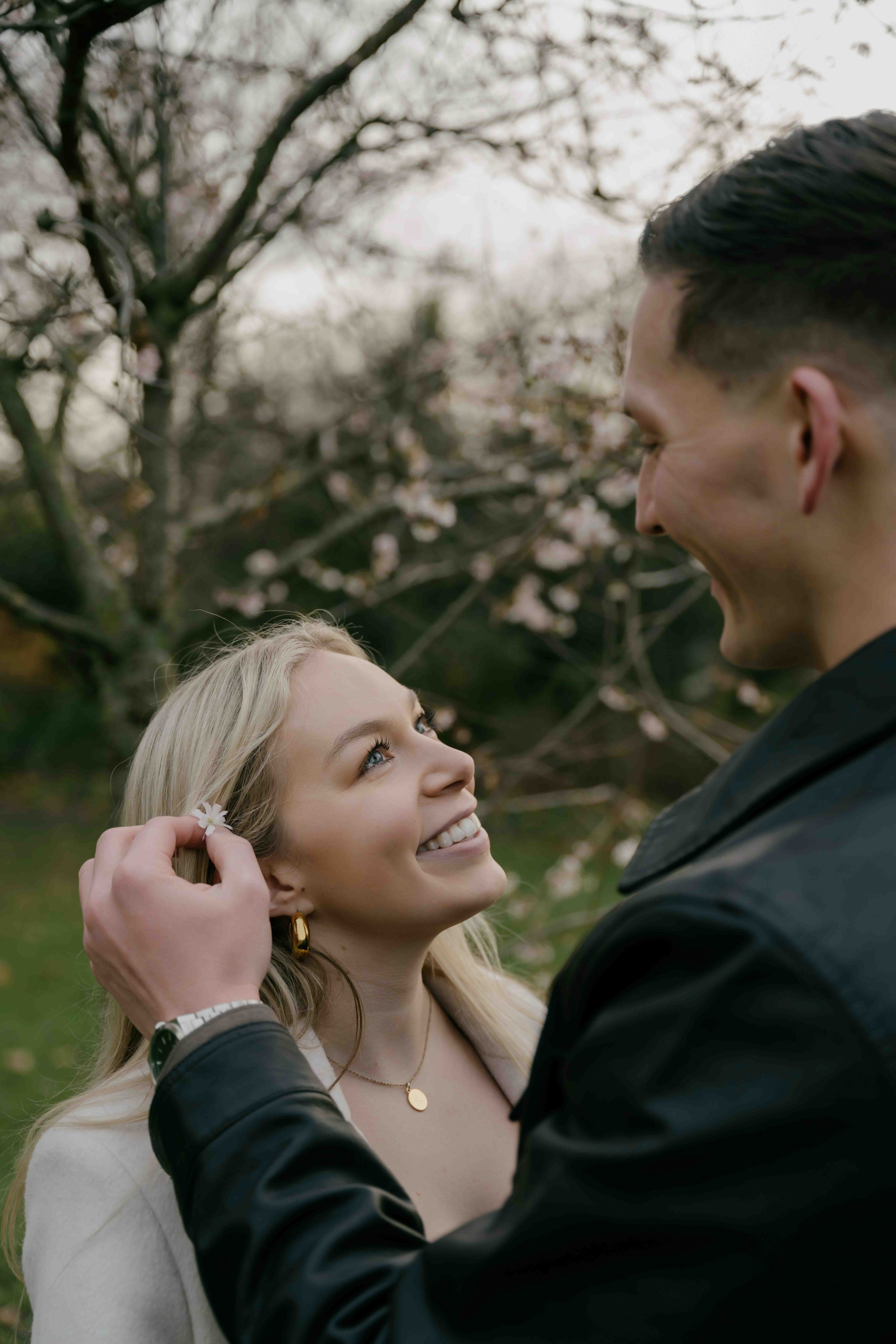 Couple embracing in St James Park London engagement session