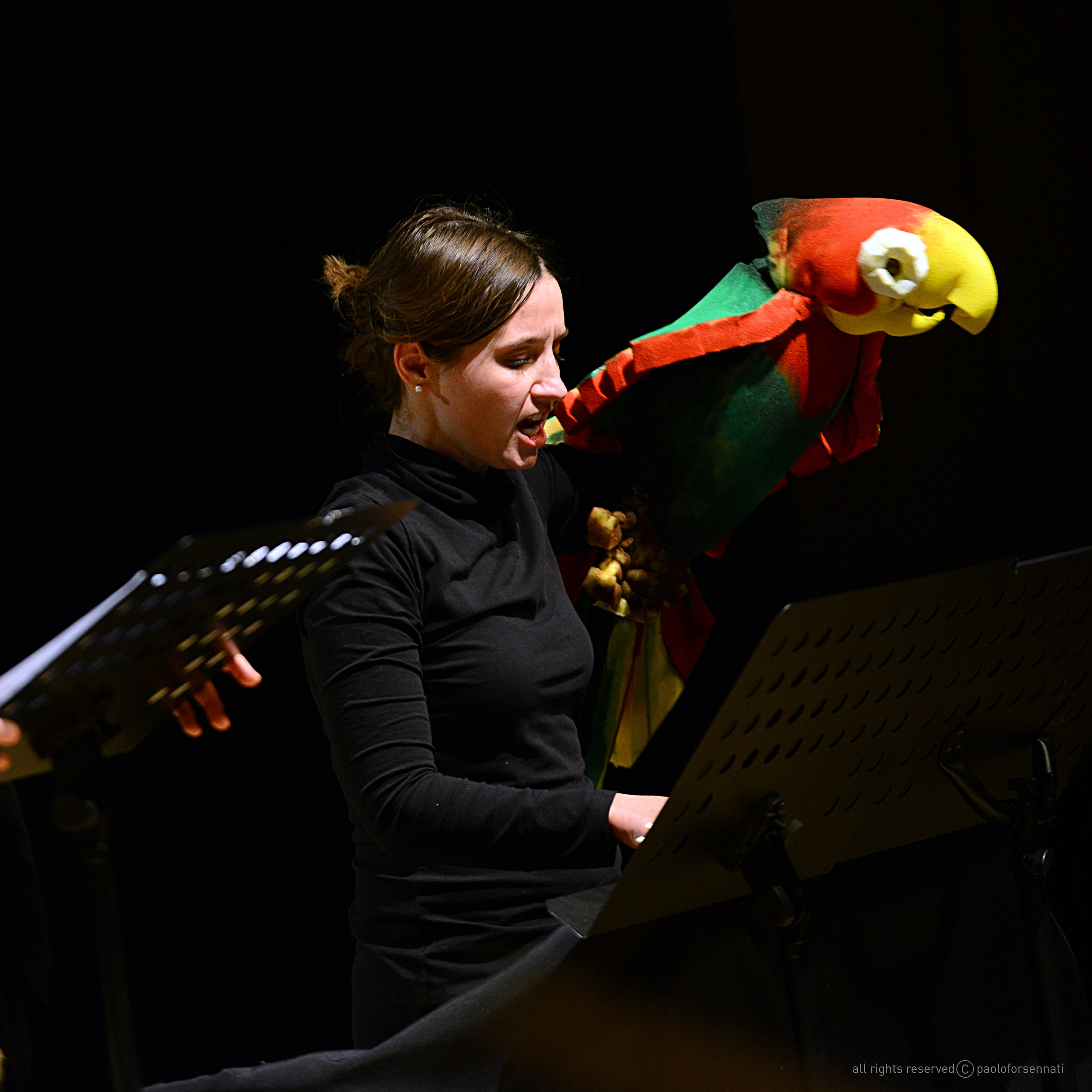 Nadia Kuprina with parrot puppet. Performance in theatre.