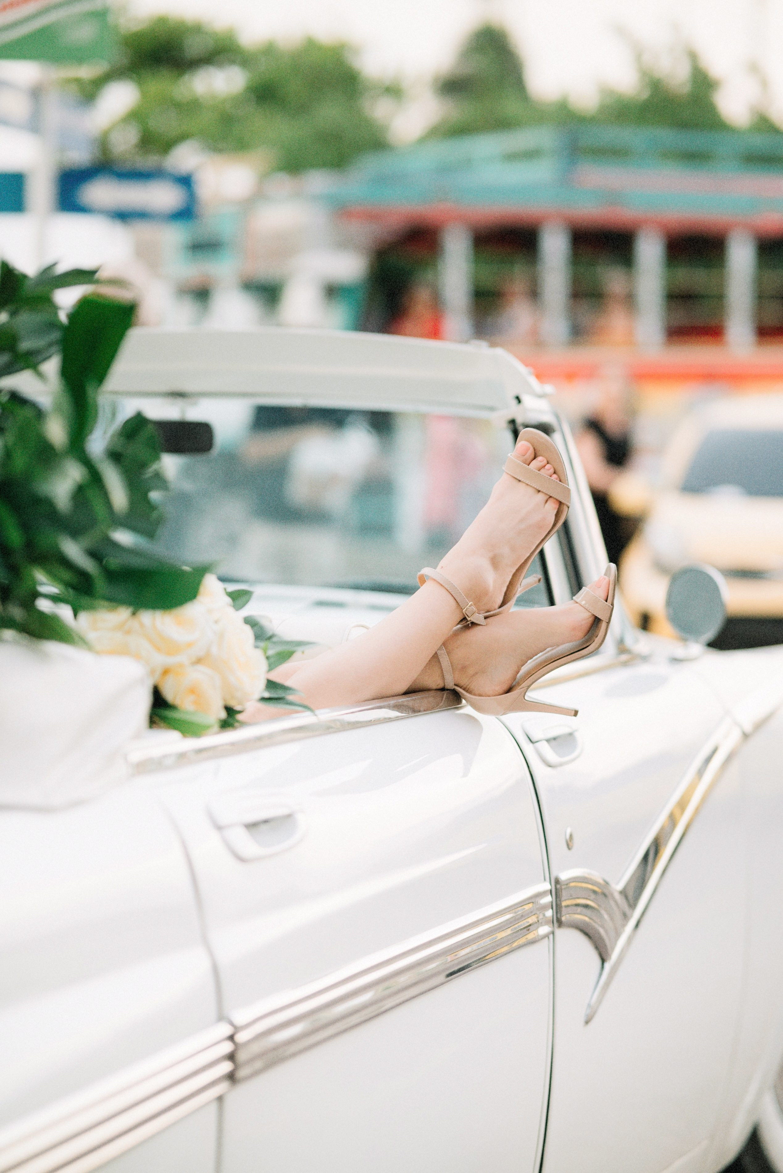 ride sitting in a convertible car in Cartagena, elegant wedding photography