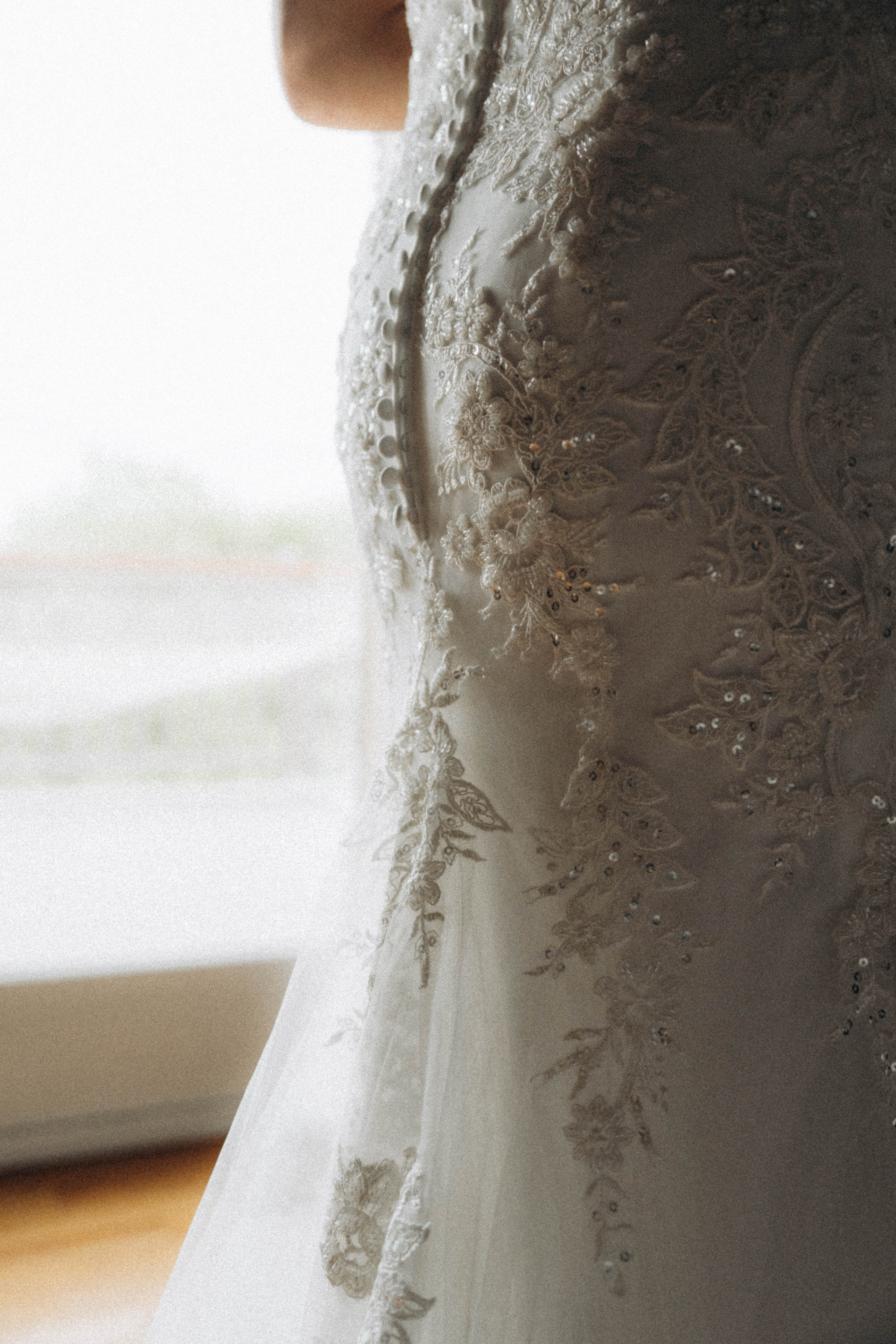 Bride with lace gown walking through Saratoga Springs.