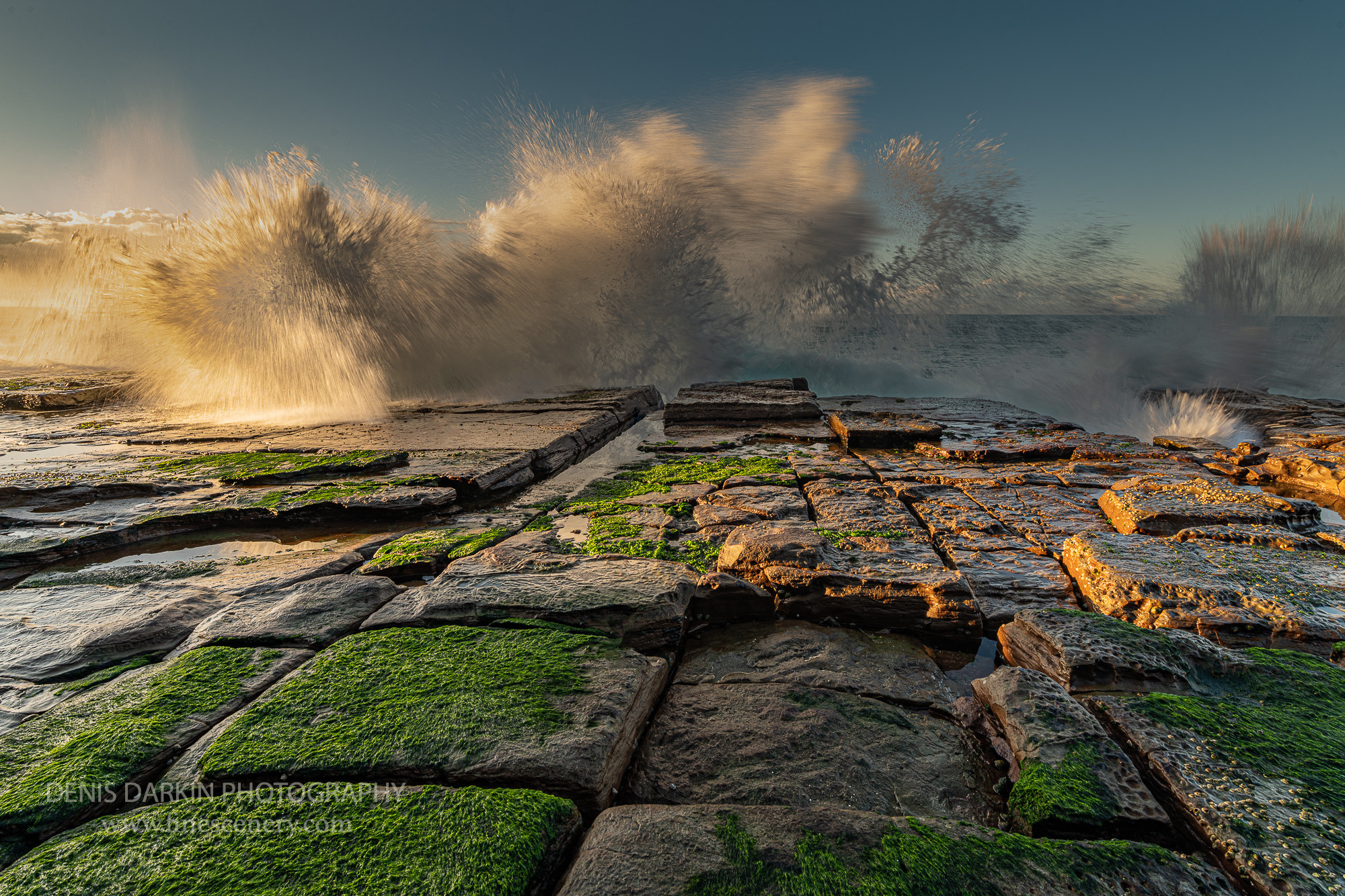 Ocean surge hitting the shore in the morning light, Bogey Hole, Newcastle, NSW