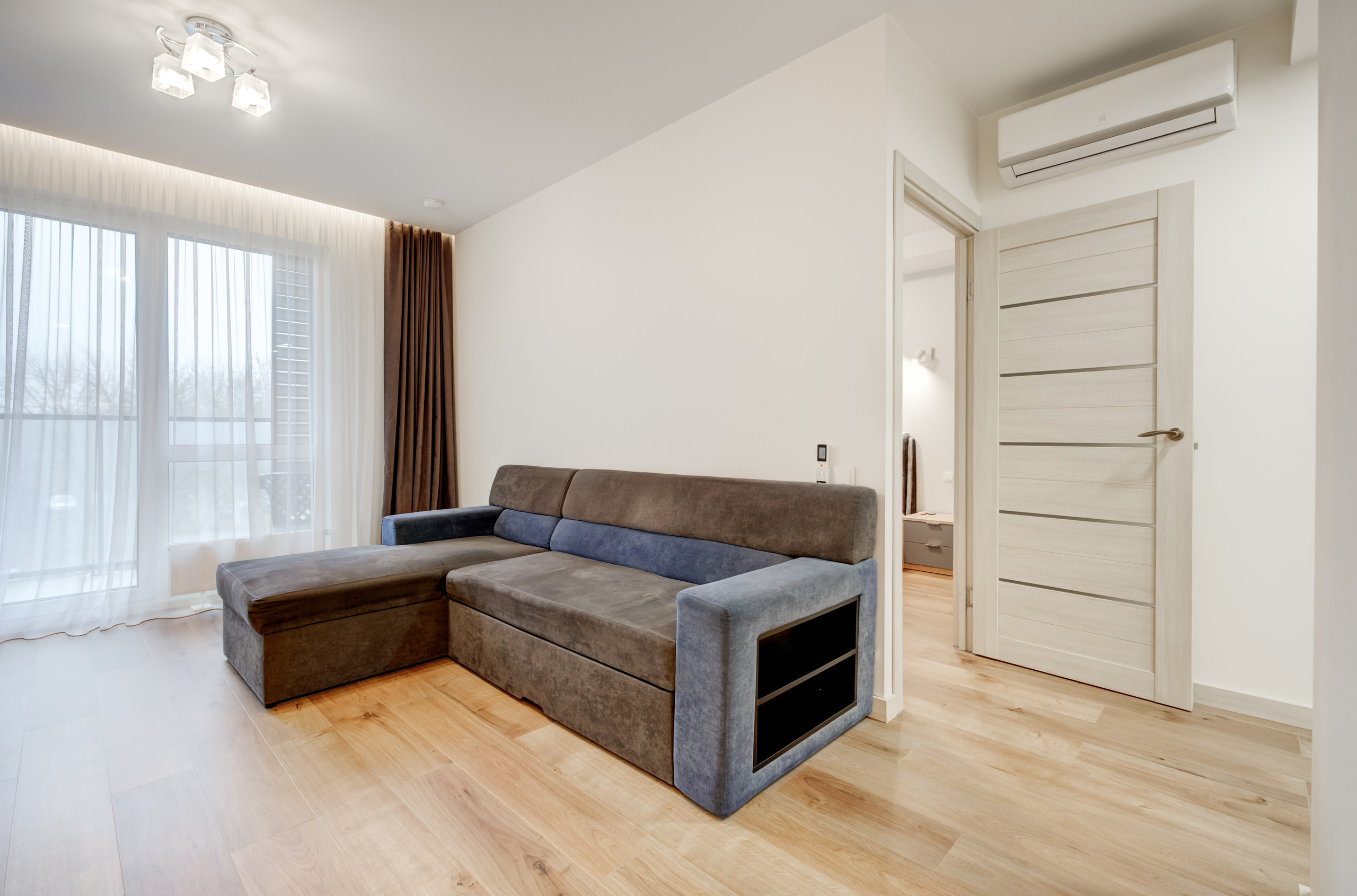 2-jų kambarių buto svetainė. Nuotrauka. Fotografė - sapiegafoto.lt