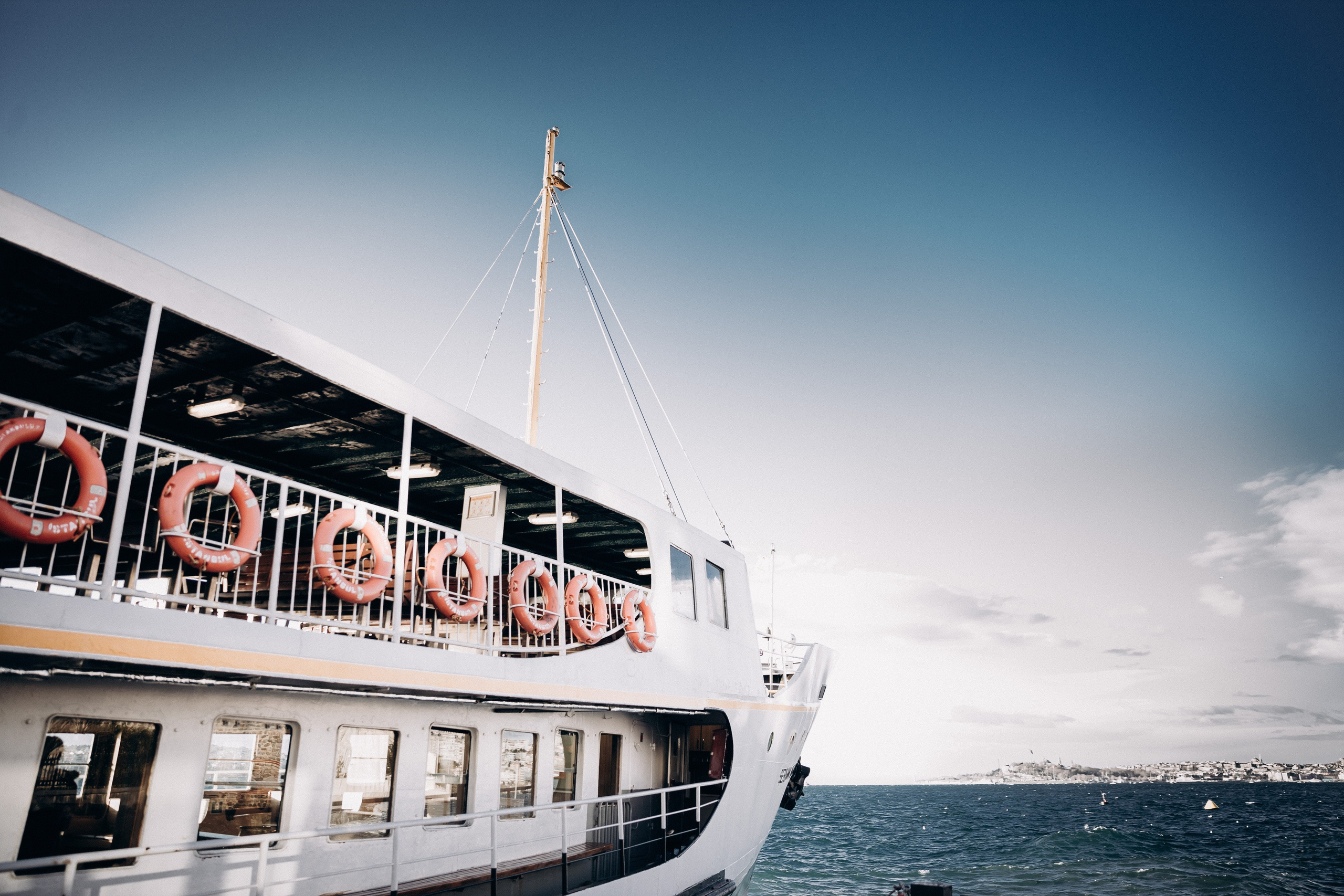 Bride and groom walking through Istanbul market square, timeless wedding photography Europe.