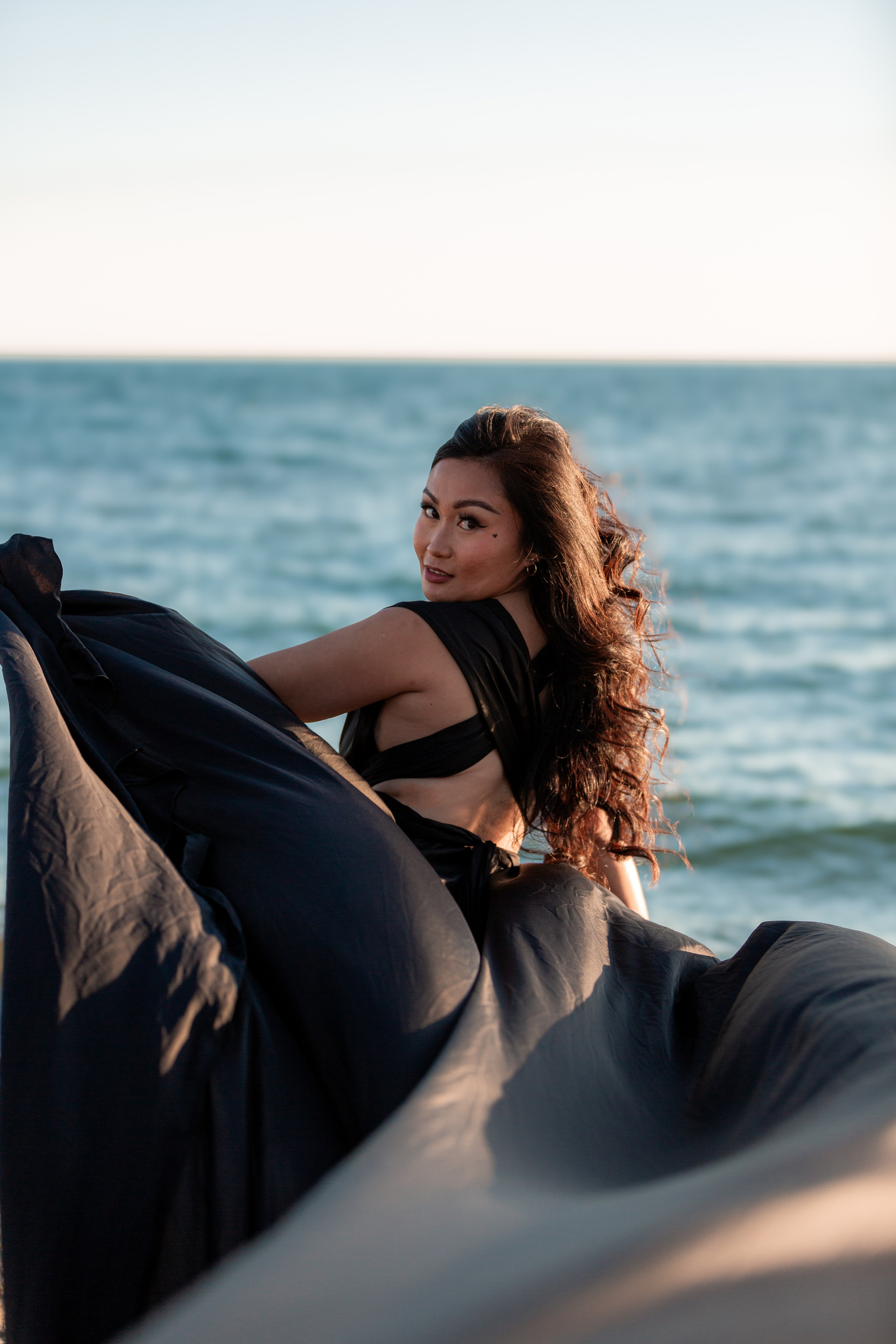 Individual portrait session by the water in Windsor, Ontario, blending natural beauty with creative photography.