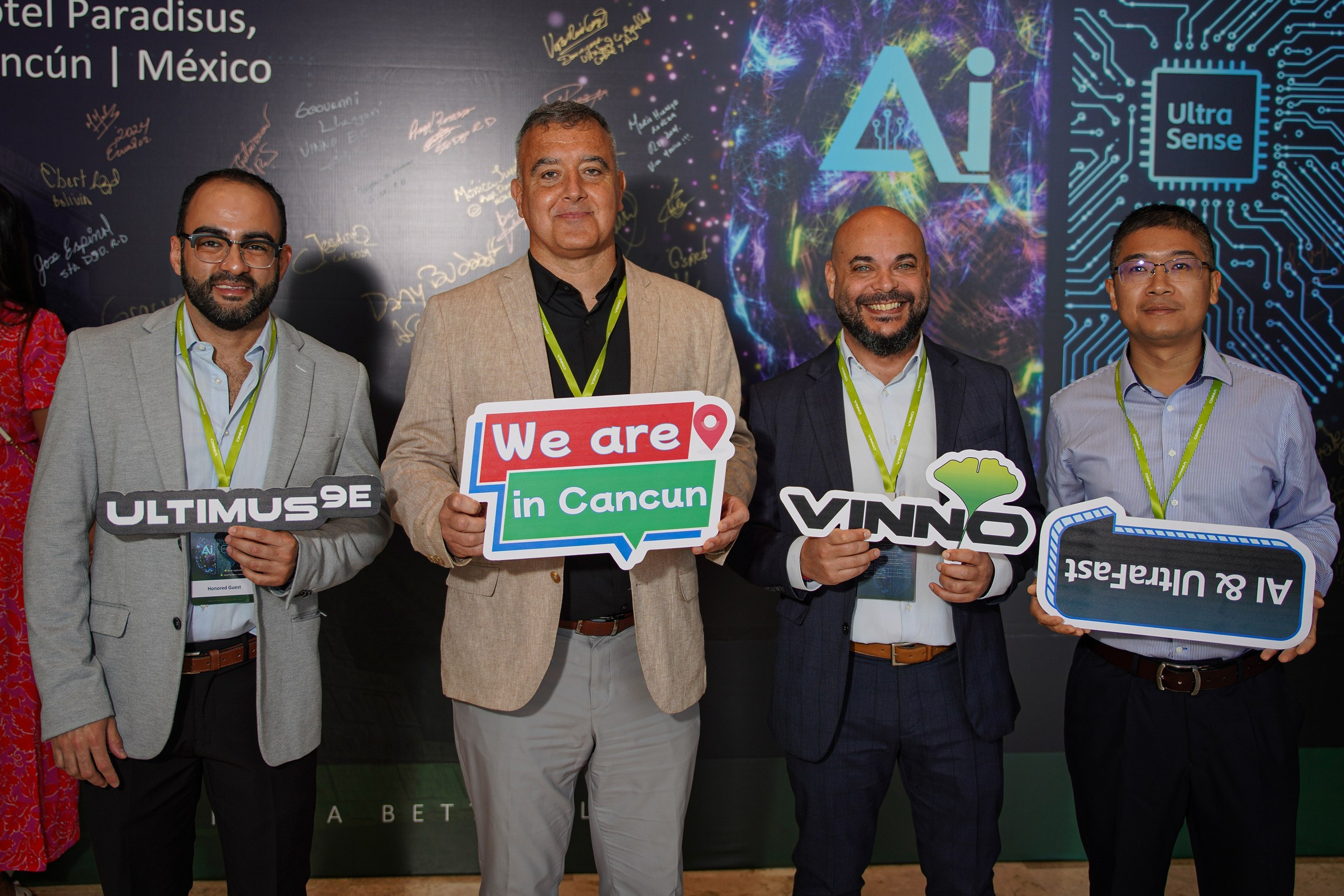 Business event group shot featuring the entire team and invited attendees.