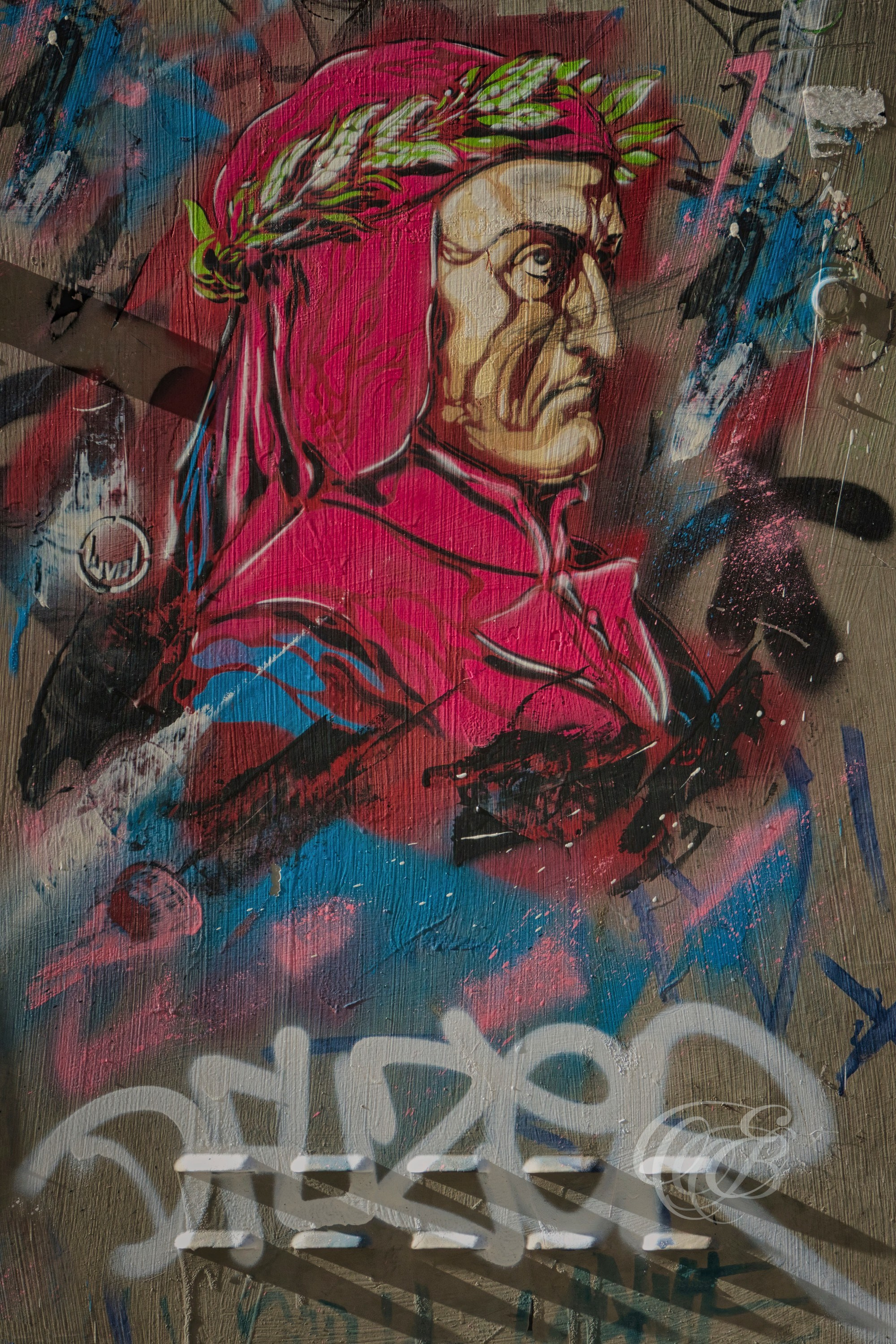 Florence, Italy—A striking urban tribute to Dante Alighieri appears in a graffiti-style mural on a weathered wall, blending historical memory with contemporary street expression. As Florence’s most iconic literary figure, Dante continues to shape the city’s cultural identity, his legacy reinterpreted here through modern visual language within the urban fabric of his birthplace. Eduardo Bartoli Photography.