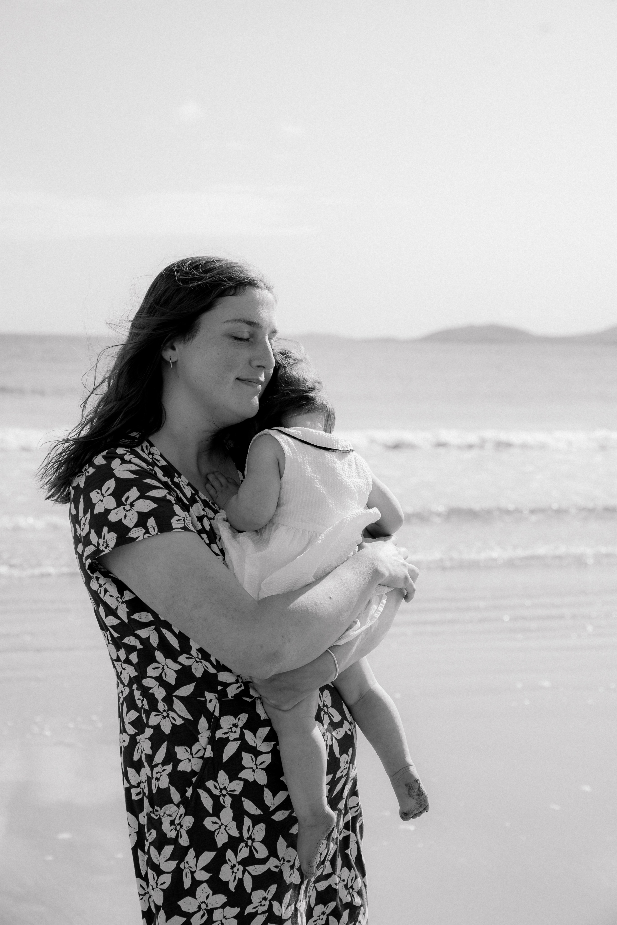 Darya and Mia at the ocean. Wedding and family photographer Ireland