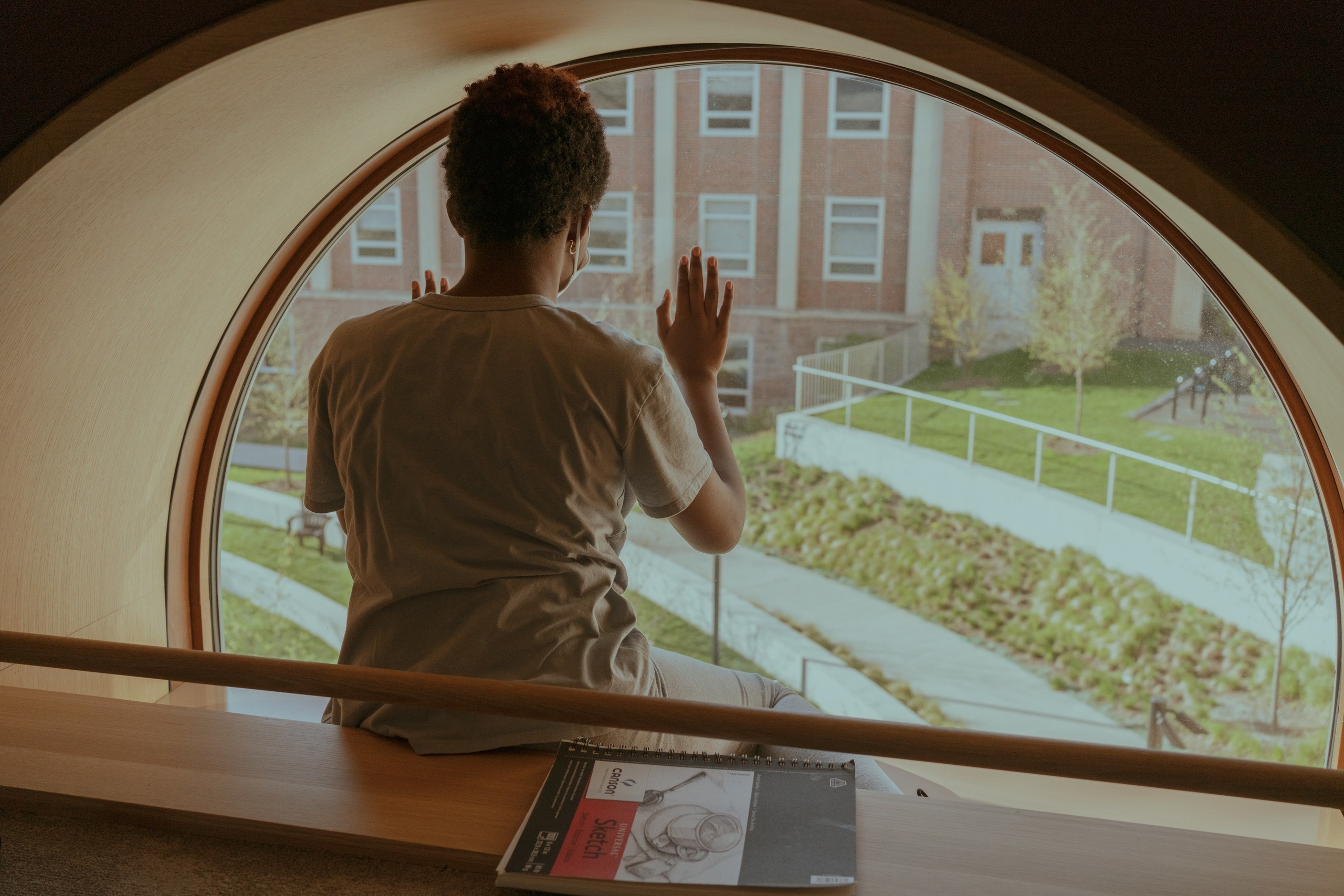 Coco at the library while her mother is studying. 