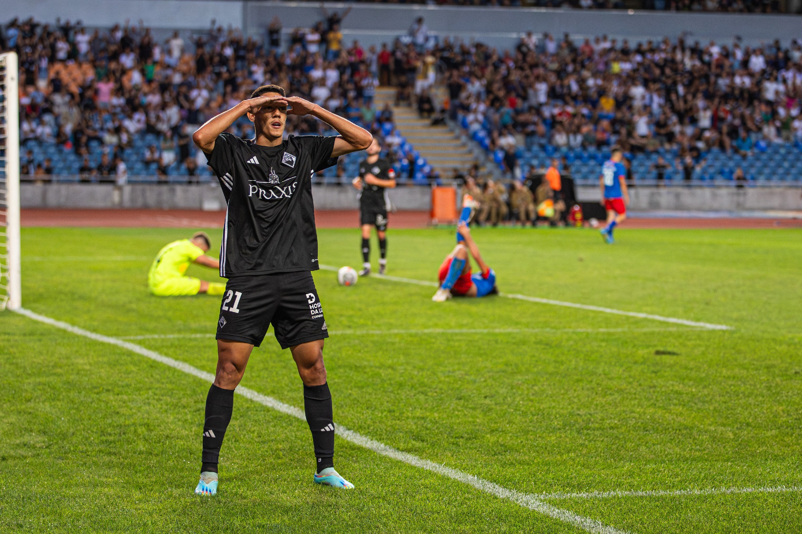 Associação Académica de Coimbra football player celebrating the score of a goal