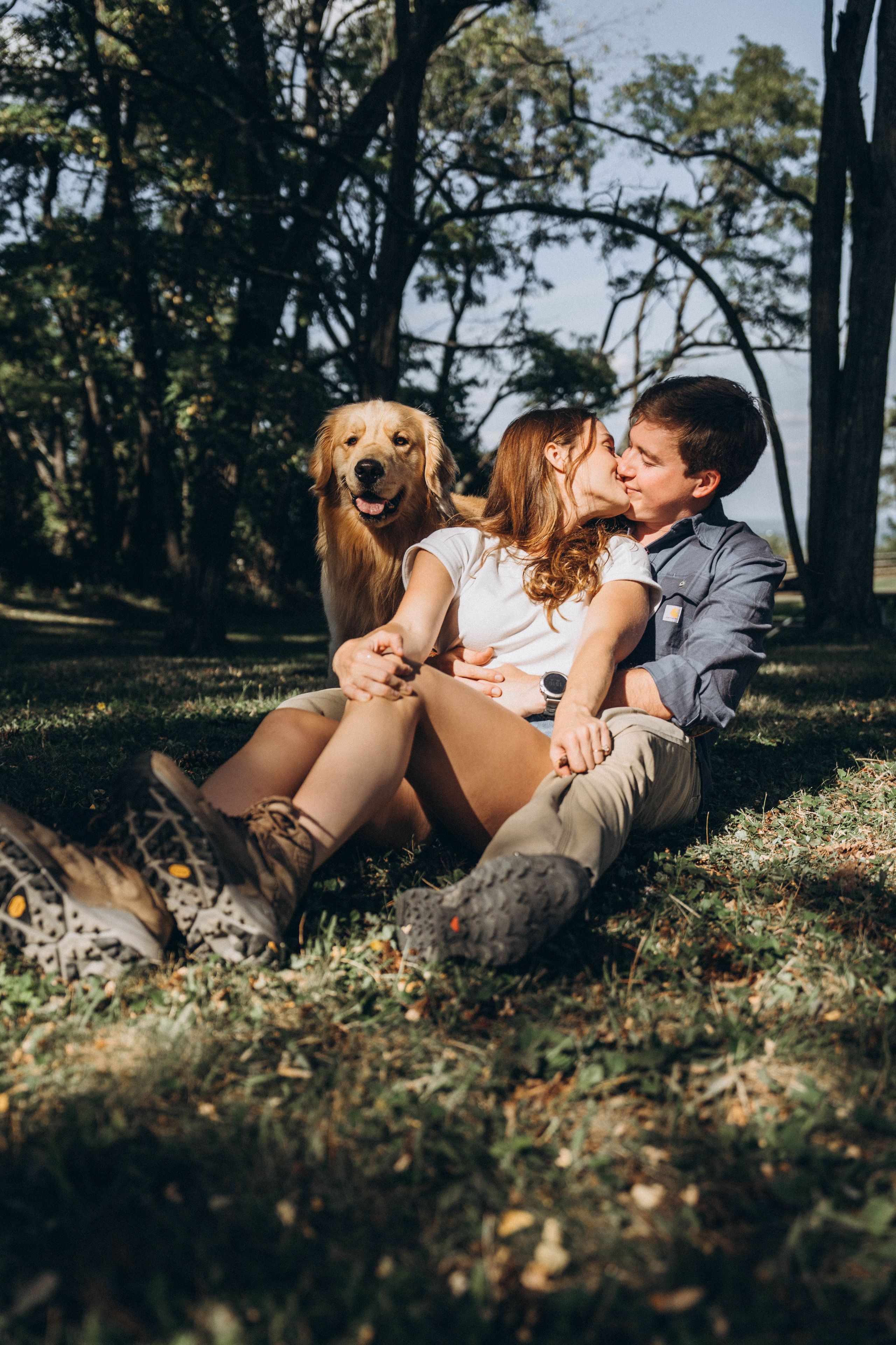 Romantic candid portrait of the engaged couple in the park 