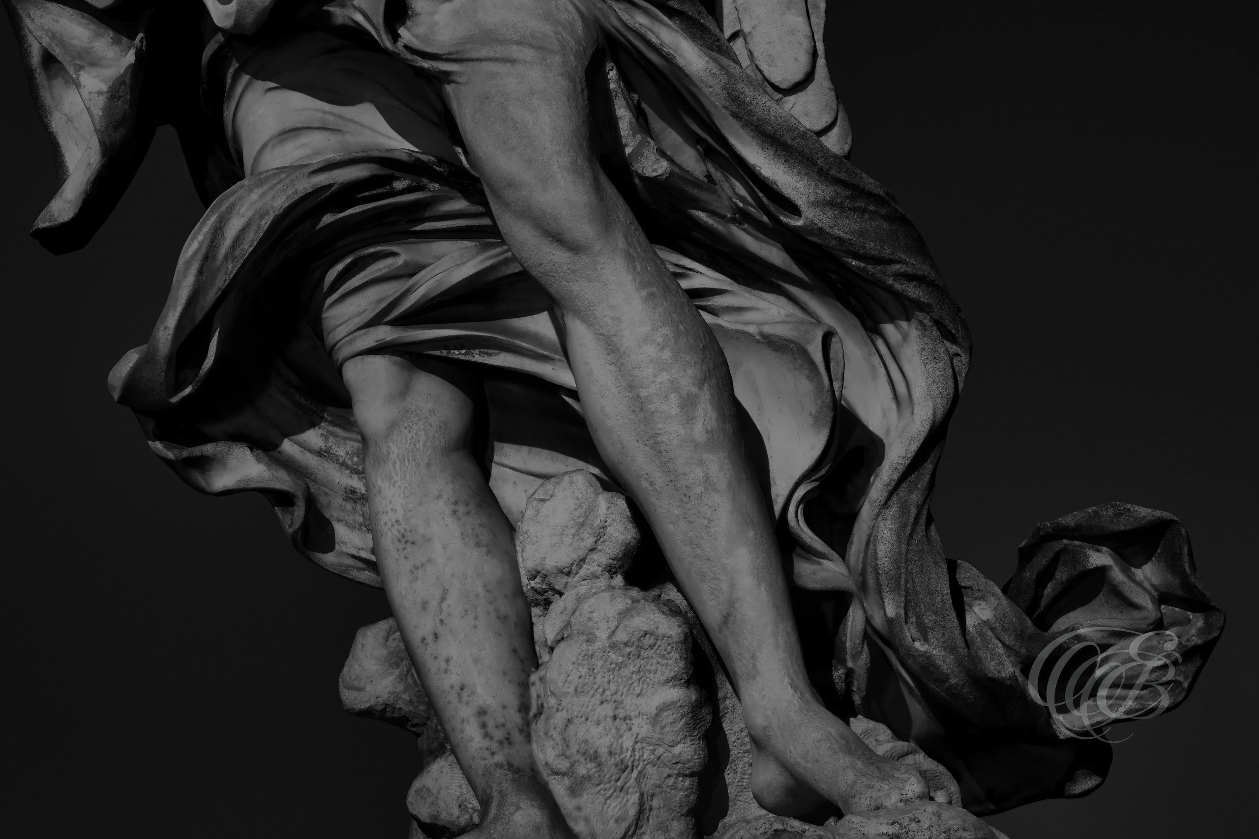 Rome Italy - Angel’s Feet at Ponte Sant’Angelo - B&W - Eduardo Bartoli Photography - Black and white photograph of the feet of an angel sculpture on Ponte Sant’Angelo in Rome, Italy, part of the Baroque angel series associated with Gian Lorenzo Bernini – photography by Eduardo Bartoli.