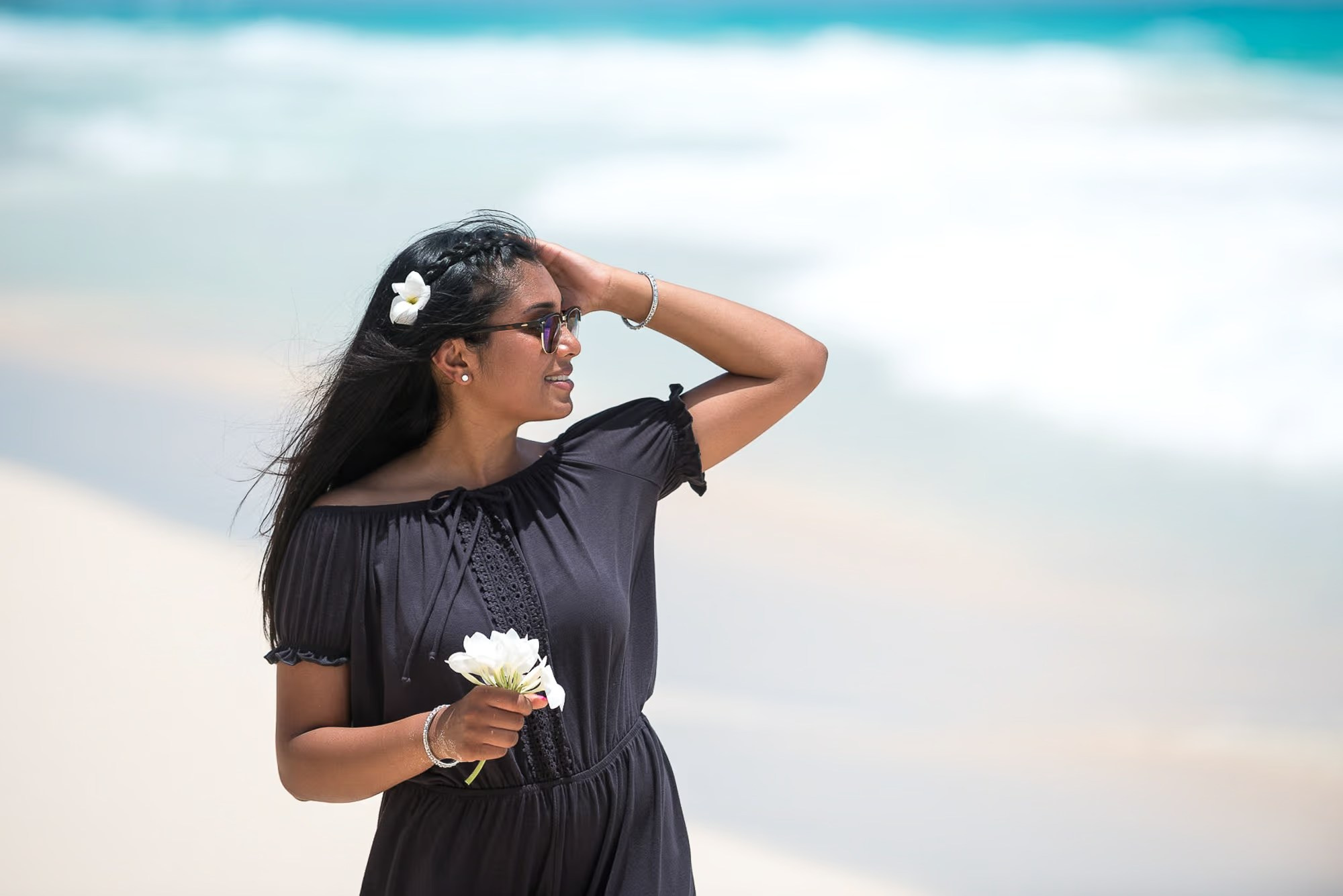 Lifestyle portrait of a traveler enjoying the tropical beach in Punta Cana.