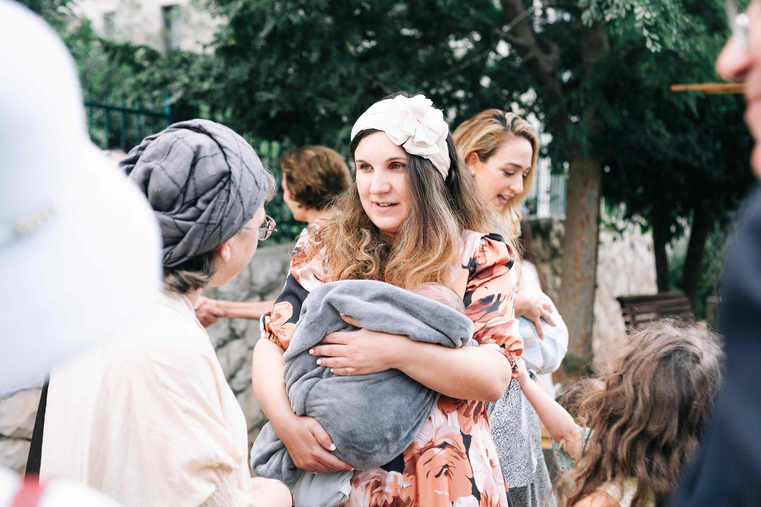 BRITH MILA IN THE SMALL SYNAGOGUE. PHOTOGRAPHER IN ISRAEL