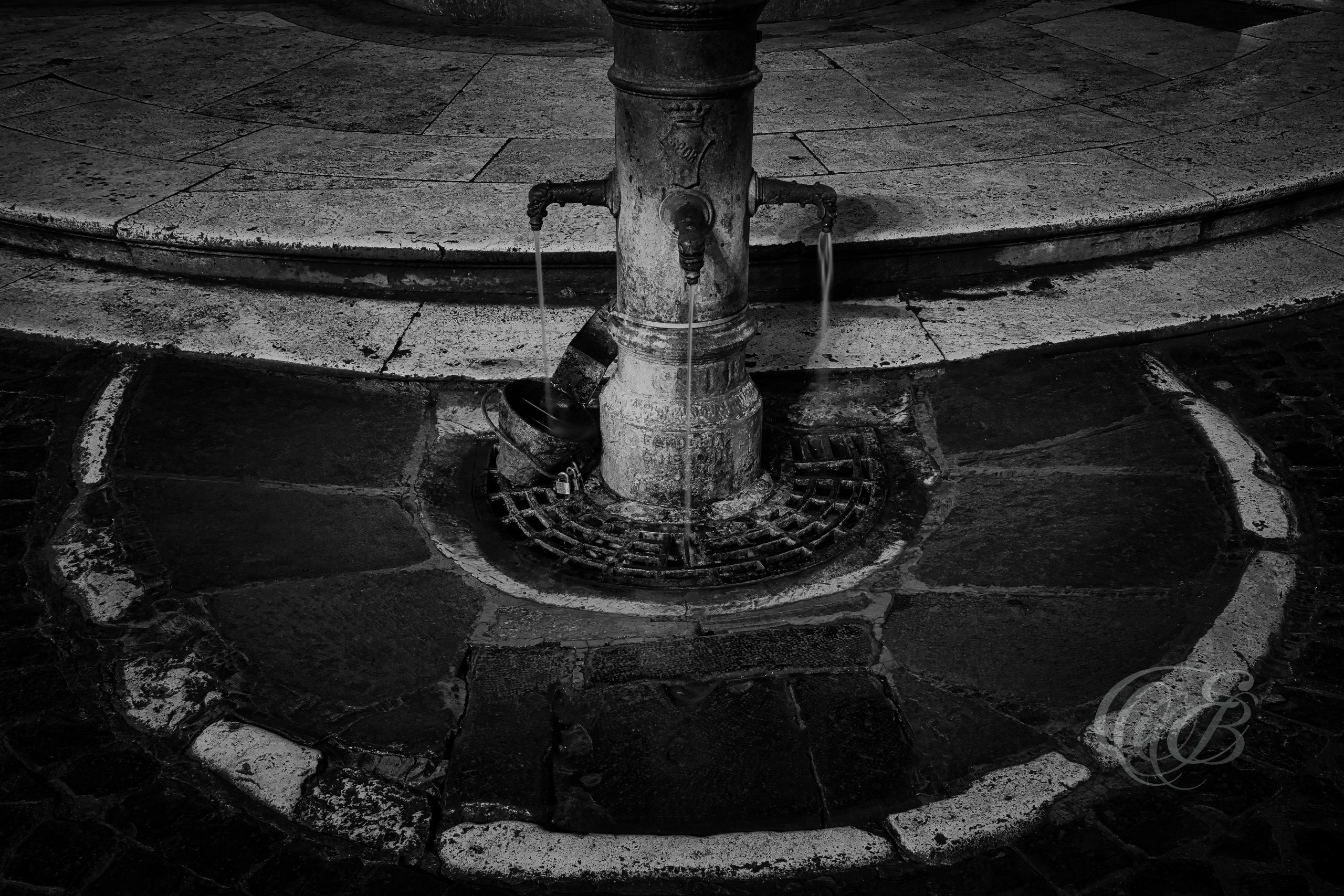 Street Photography — Rome, Italy — Piazza della Rotonda Nasoni — B&W — Black and white study of a traditional Roman drinking fountain, known as a nasone, near Piazza della Rotonda, reflecting the city’s historic public water system, everyday urban life, and distinctive street infrastructure — Eduardo Bartoli Photography.