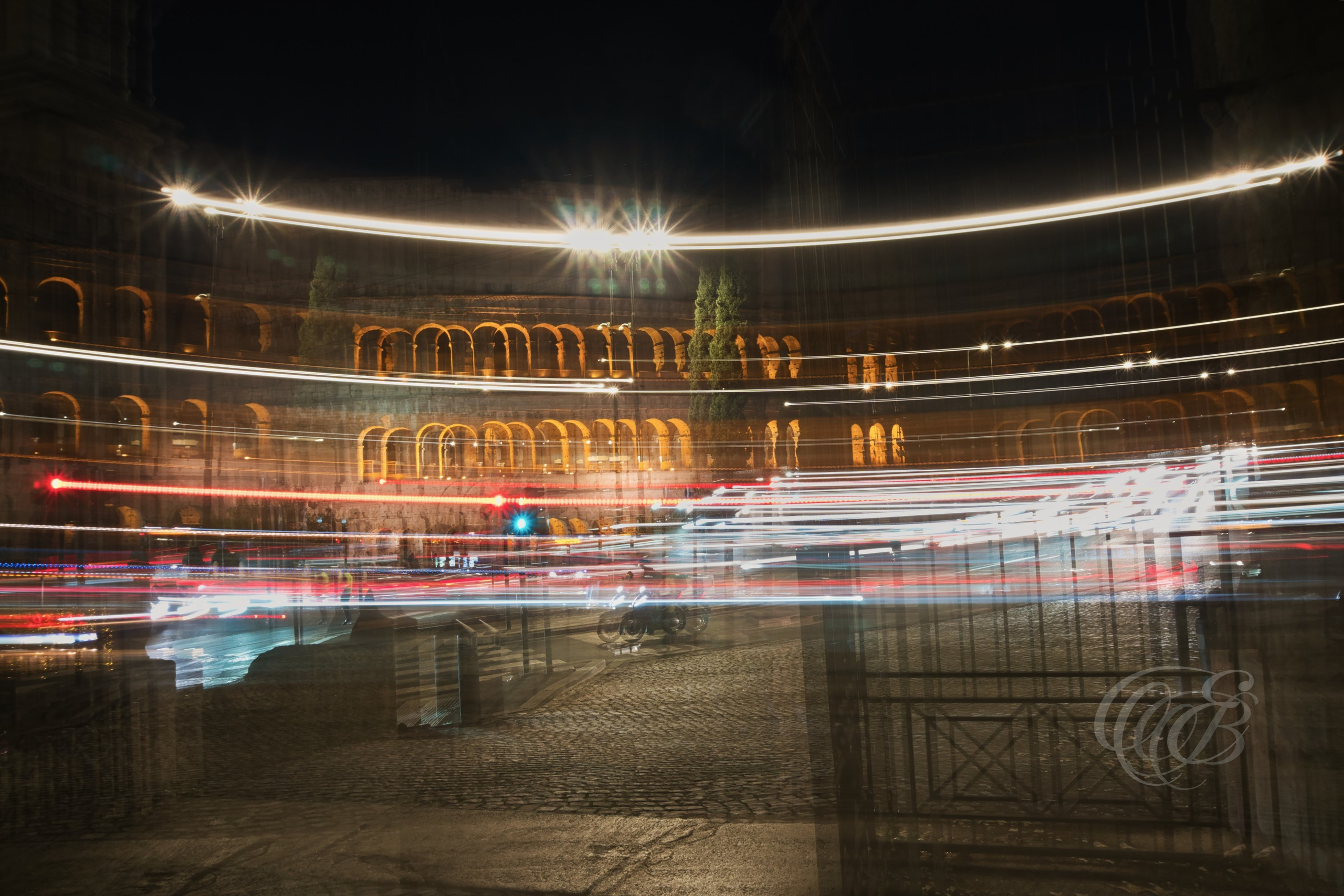 Street Photography — Rome, Italy — Moving Colosseum — Long-exposure view of the Colosseum in Rome, contrasting the ancient amphitheater with the movement and changing rhythms of the modern city — Eduardo Bartoli Photography.