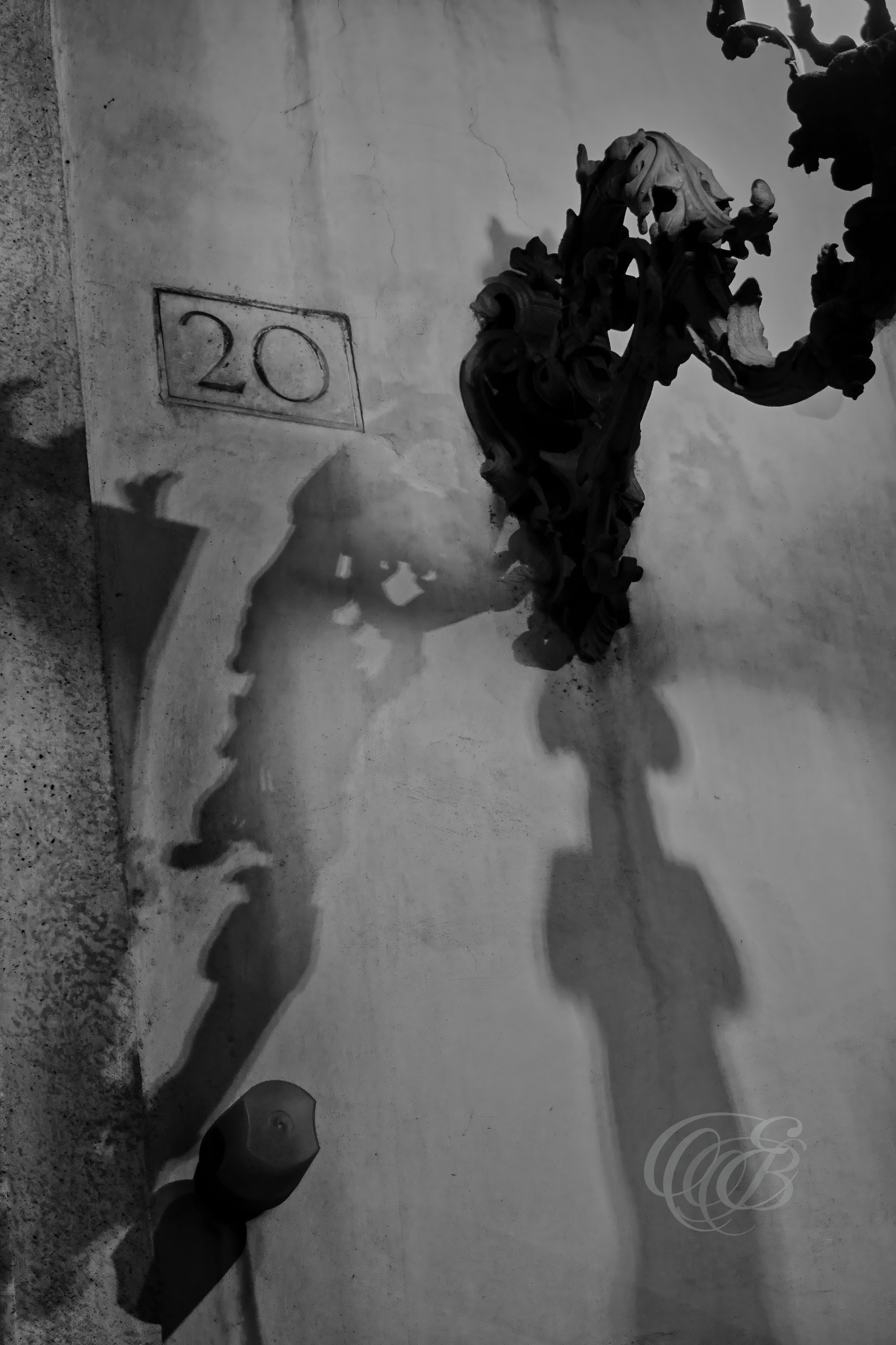 Street Photography — Rome, Italy — Abstract Light — B&W — Black and white abstract study of street-lamp light and shadows in Rome, emphasizing tonal contrast, geometric forms, illumination, and the transformation of an everyday urban surface — Eduardo Bartoli Photography.