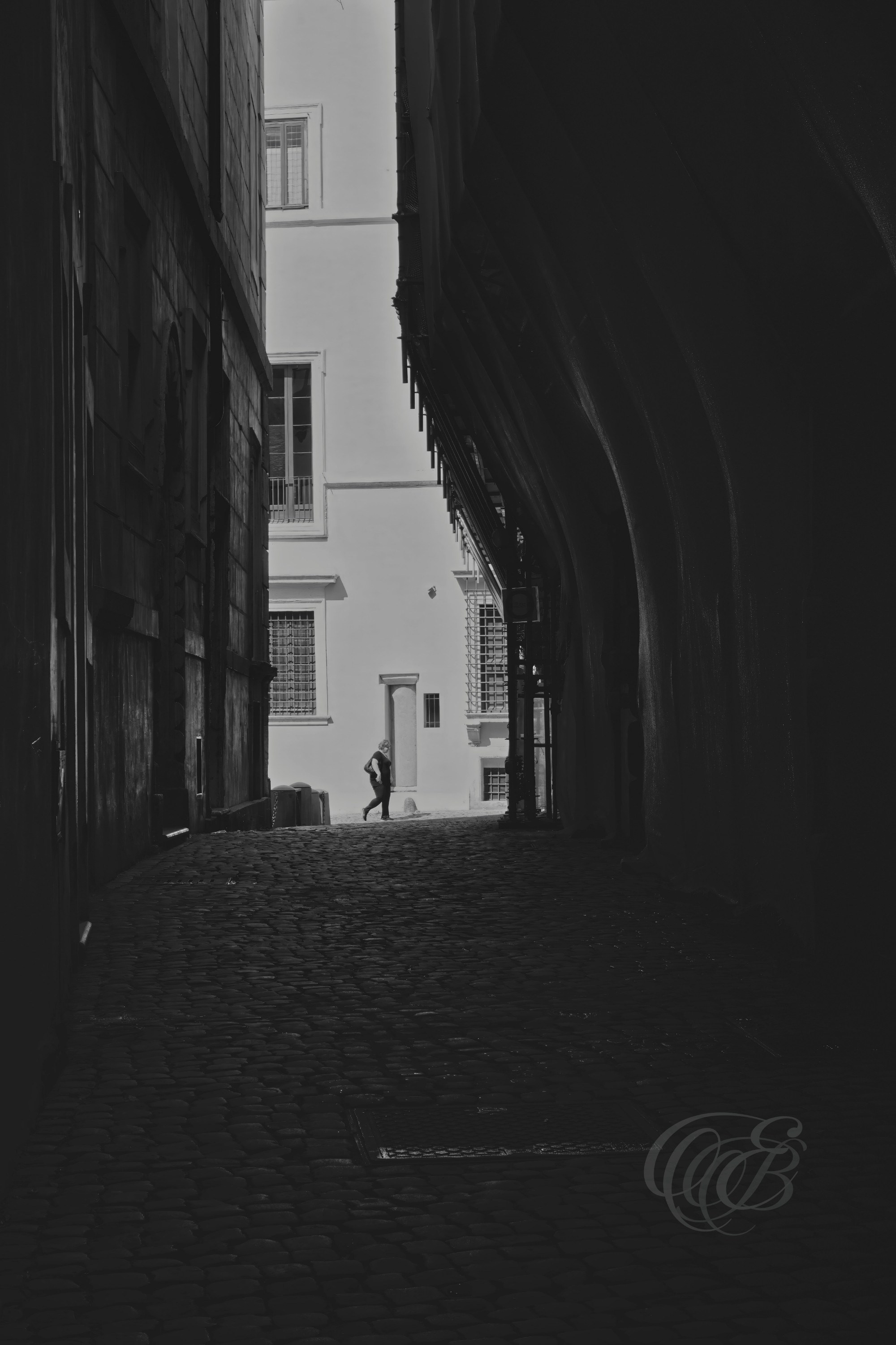 Street Photography — Rome, Italy — Via Sant’Angelo in Pescheria — B&W Matte — Matte black and white interpretation of the historic street near the Portico of Octavia, emphasizing aged architecture, urban textures, and the layered history of Rome’s Jewish Ghetto — Eduardo Bartoli Photography.