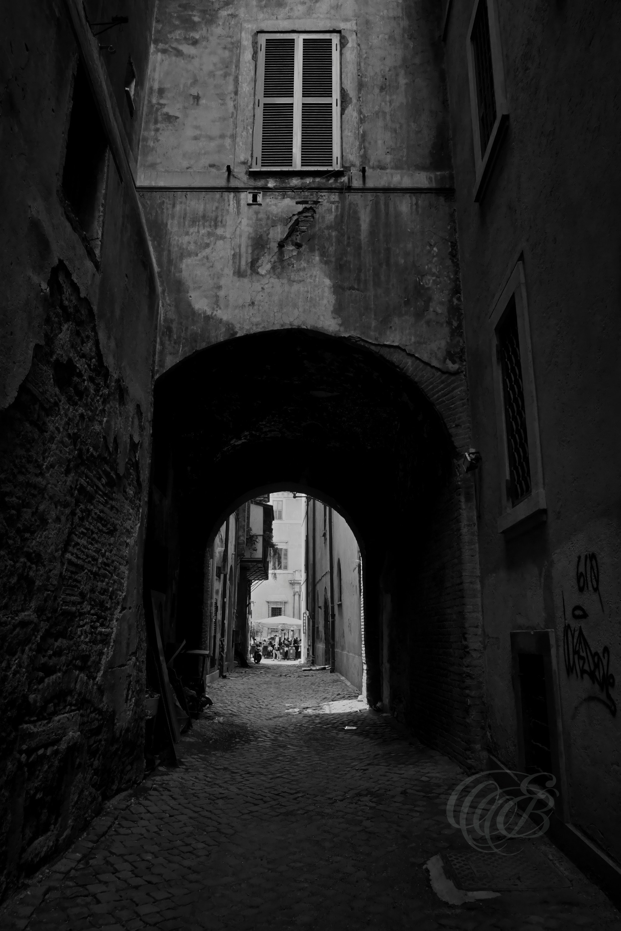 Street Photography — Rome, Italy — Via dei Tre Archi — B&W — Black and white interpretation of historic Via dei Tre Archi in Rome, emphasizing traditional architecture, aged textures, and the intimate character of the old city — Eduardo Bartoli Photography.