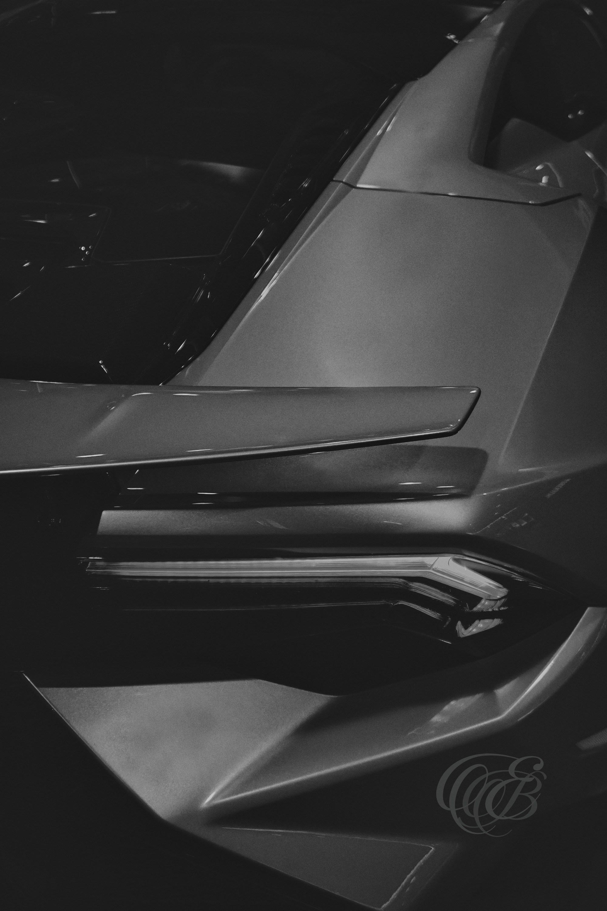 Street Photography — Rome, Italy — Lamborghini Huracán — B&W Matte — Matte black and white study of the Lamborghini Huracán in Rome, emphasizing Italian automotive design, sculpted geometry, engineering, and the contrast between a modern supercar and the historic city — Eduardo Bartoli Photography.