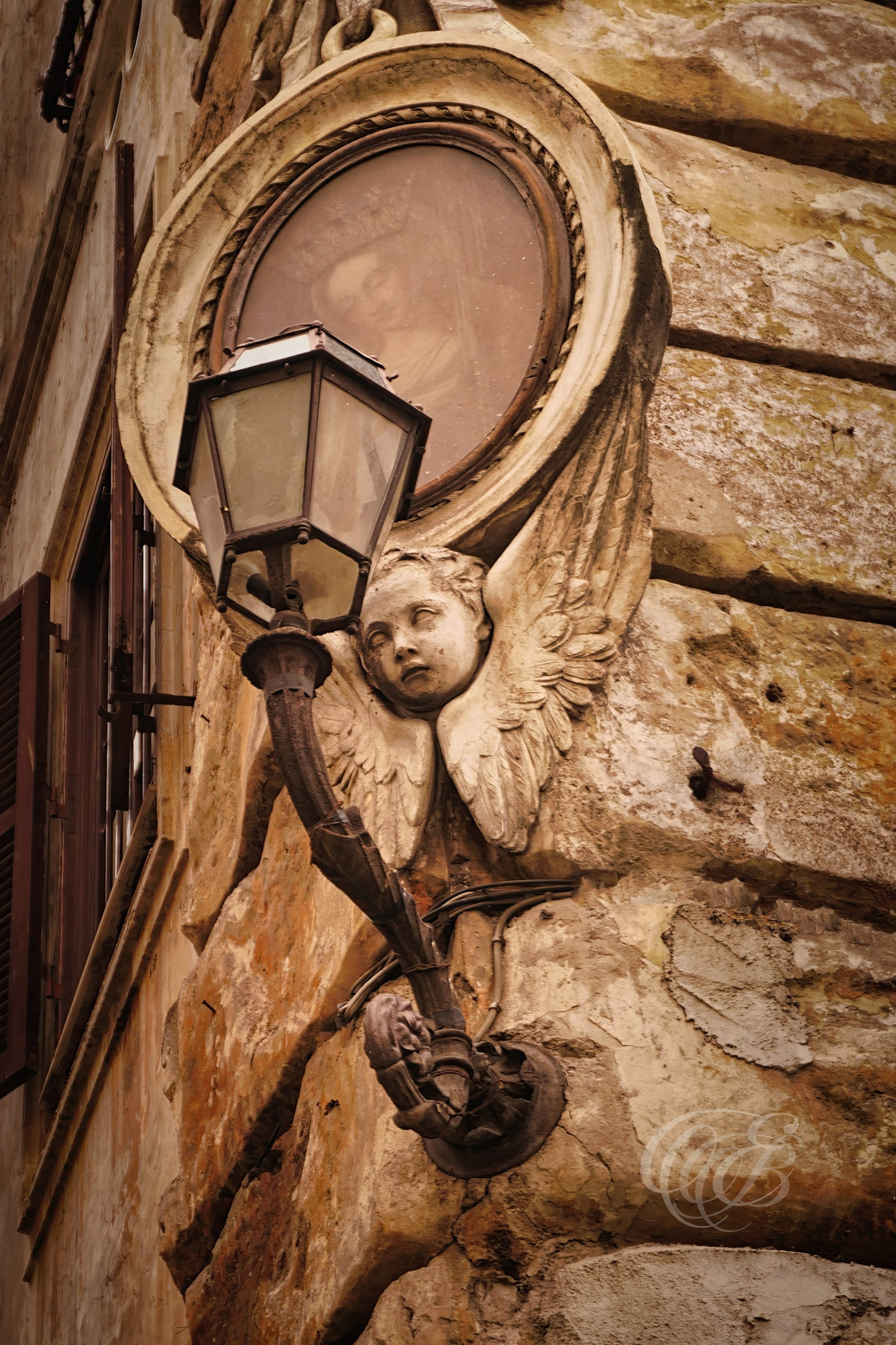 Street Photography — Rome, Italy — Detail of a Building in Trastevere — Architectural detail of a building in Rome’s historic Trastevere neighborhood, capturing weathered textures and the distinctive character of its traditional urban streetscape — Eduardo Bartoli Photography.