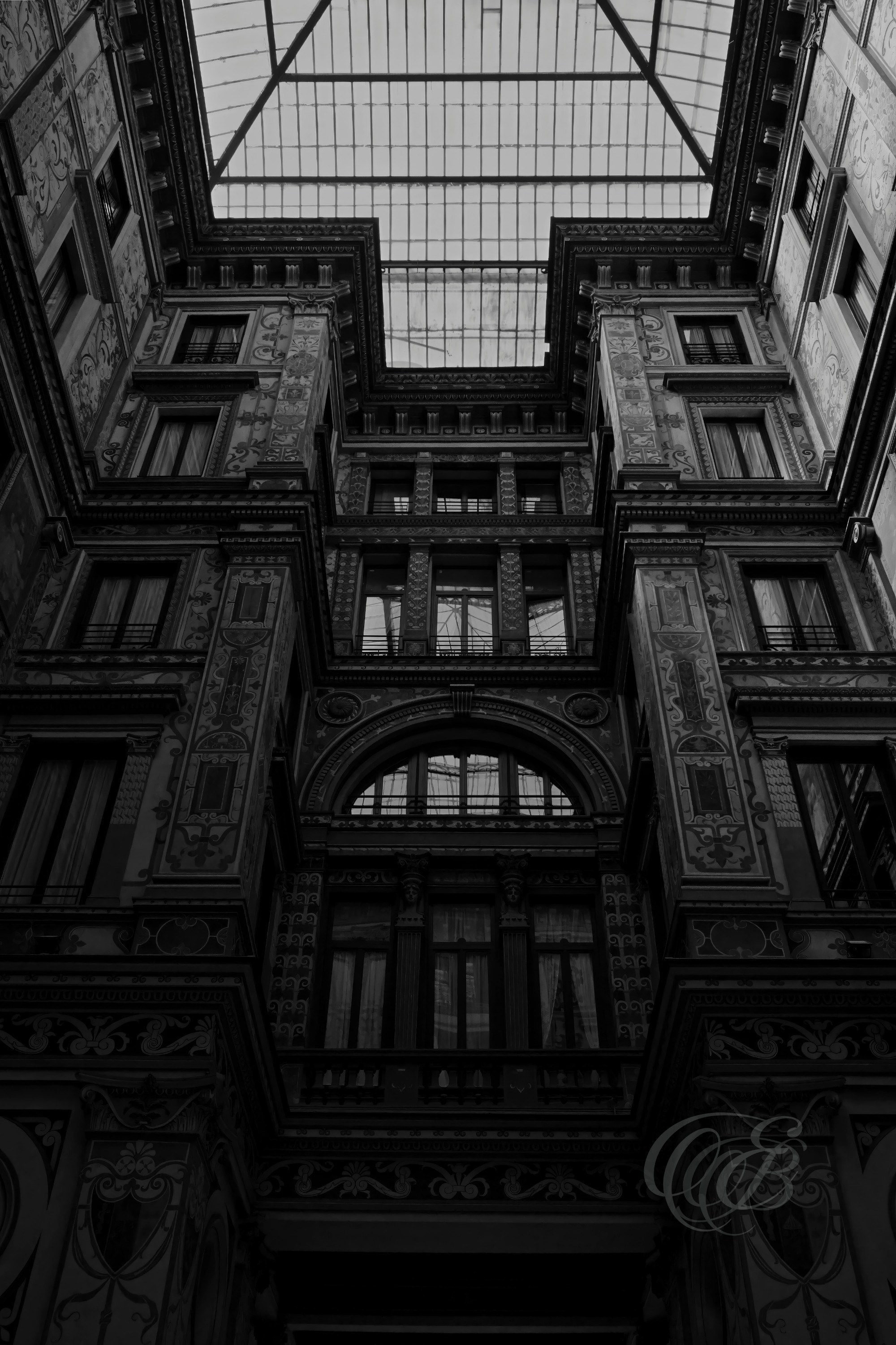 Street Photography — Rome, Italy — Galleria Sciarra Interior — B&W — Black and white interpretation of the interior of Galleria Sciarra in central Rome, emphasizing late nineteenth-century architecture, Giuseppe Cellini’s frescoes, decorative details, and geometric forms — Eduardo Bartoli Photography.