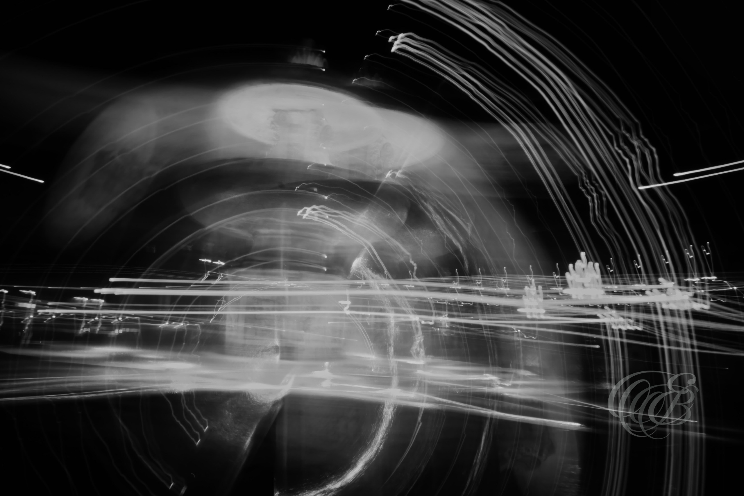 Street Photography — Rome, Italy — Moving Lights — B&W — Black and white abstract long-exposure interpretation of an illuminated Vatican fountain, emphasizing moving light, flowing forms, tonal contrast, and photographic motion — Eduardo Bartoli Photography.