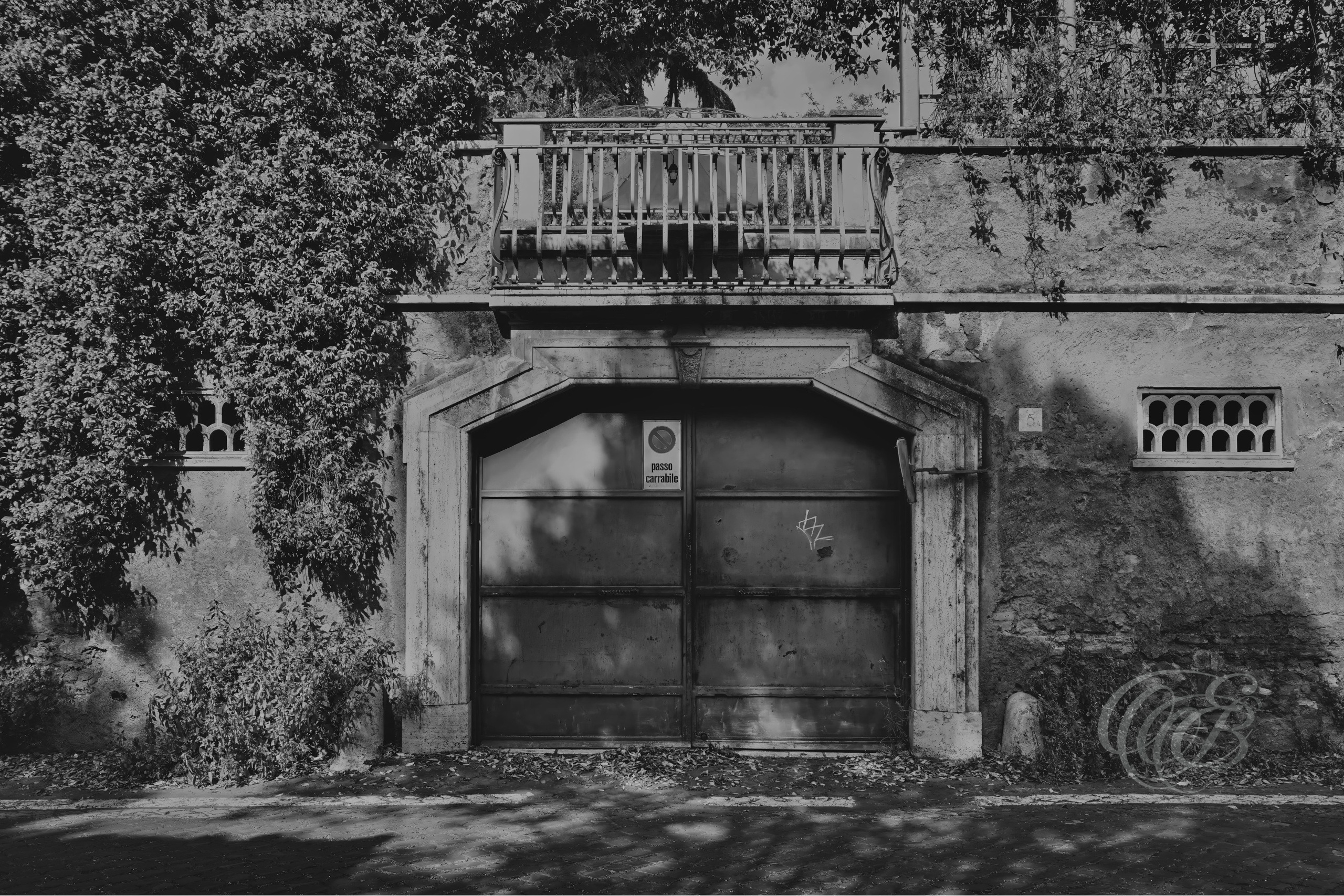 Street Photography — Rome, Italy — Via di Porta San Sebastiano — B&W Matte — Matte black and white interpretation of historic Via di Porta San Sebastiano in Rome, emphasizing ancient walls, aged architecture, tonal textures, and its connection with the Via Appia — Eduardo Bartoli Photography.