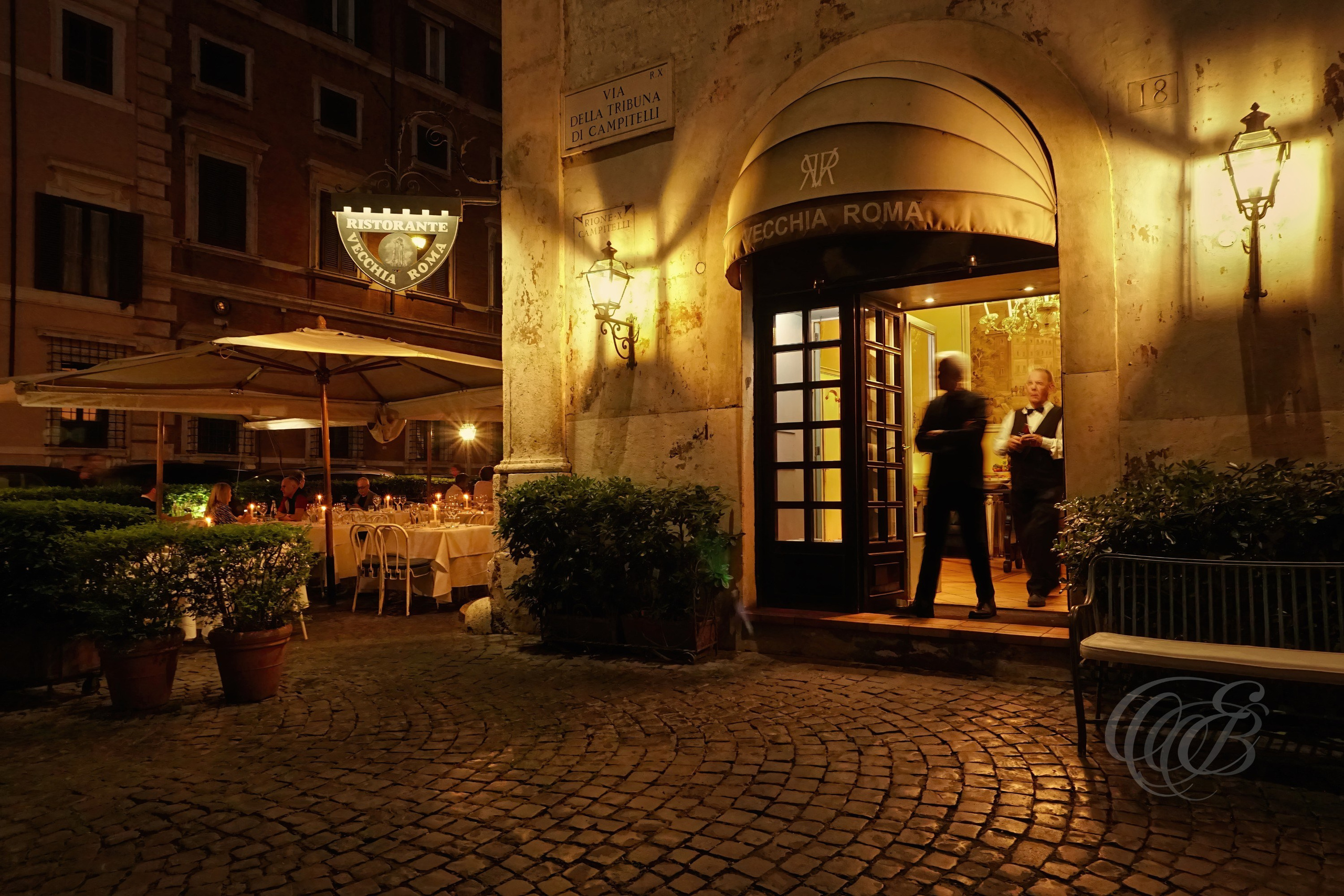 Street Photography — Rome, Italy — Vecchia Roma — Traditional Roman restaurant during the evening, reflecting the warm atmosphere, local dining culture, and lively character of Rome’s streets after dark — Eduardo Bartoli Photography.
