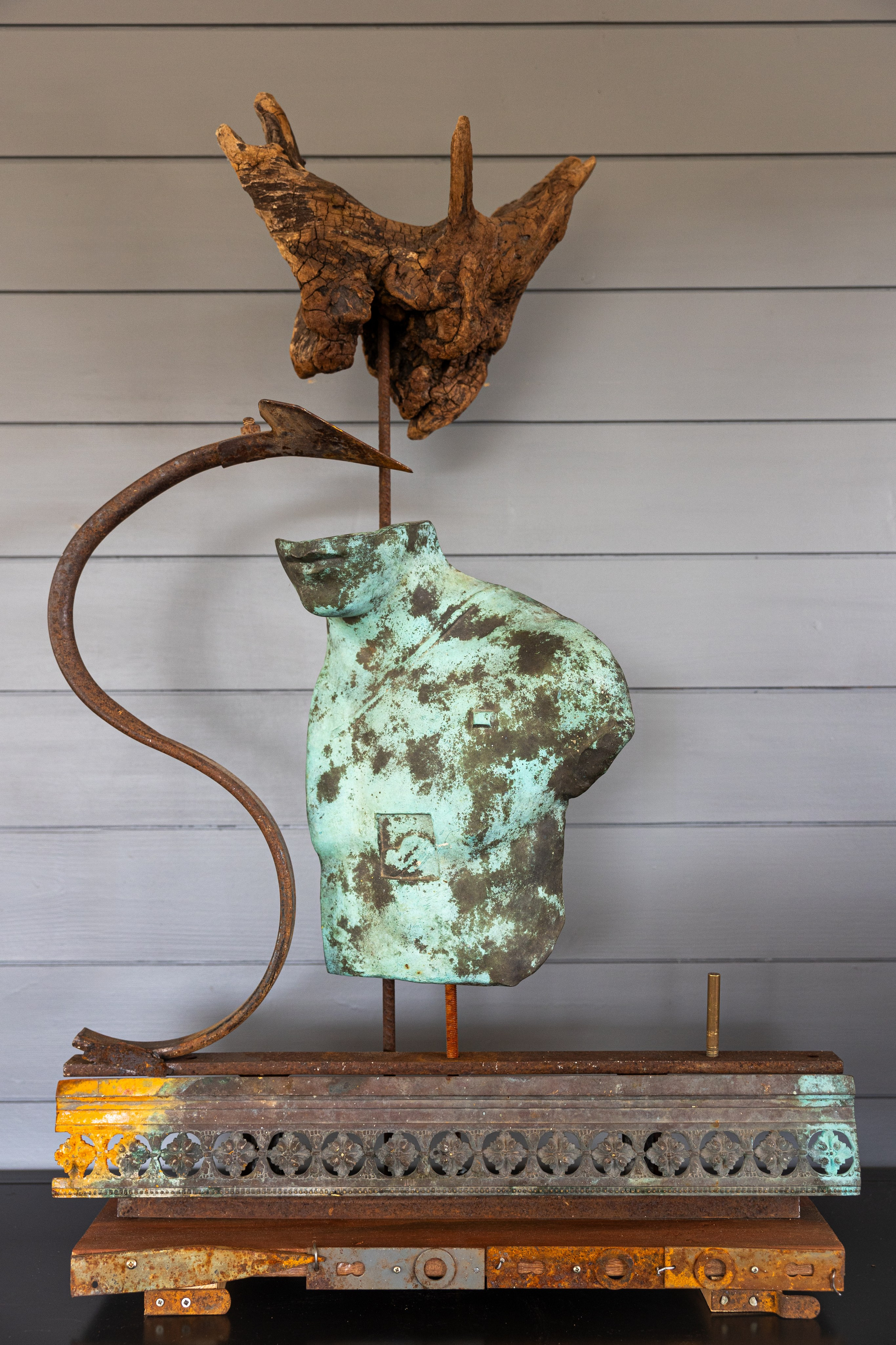 Imaginary metallic Statue of Liberty with her wood hat 