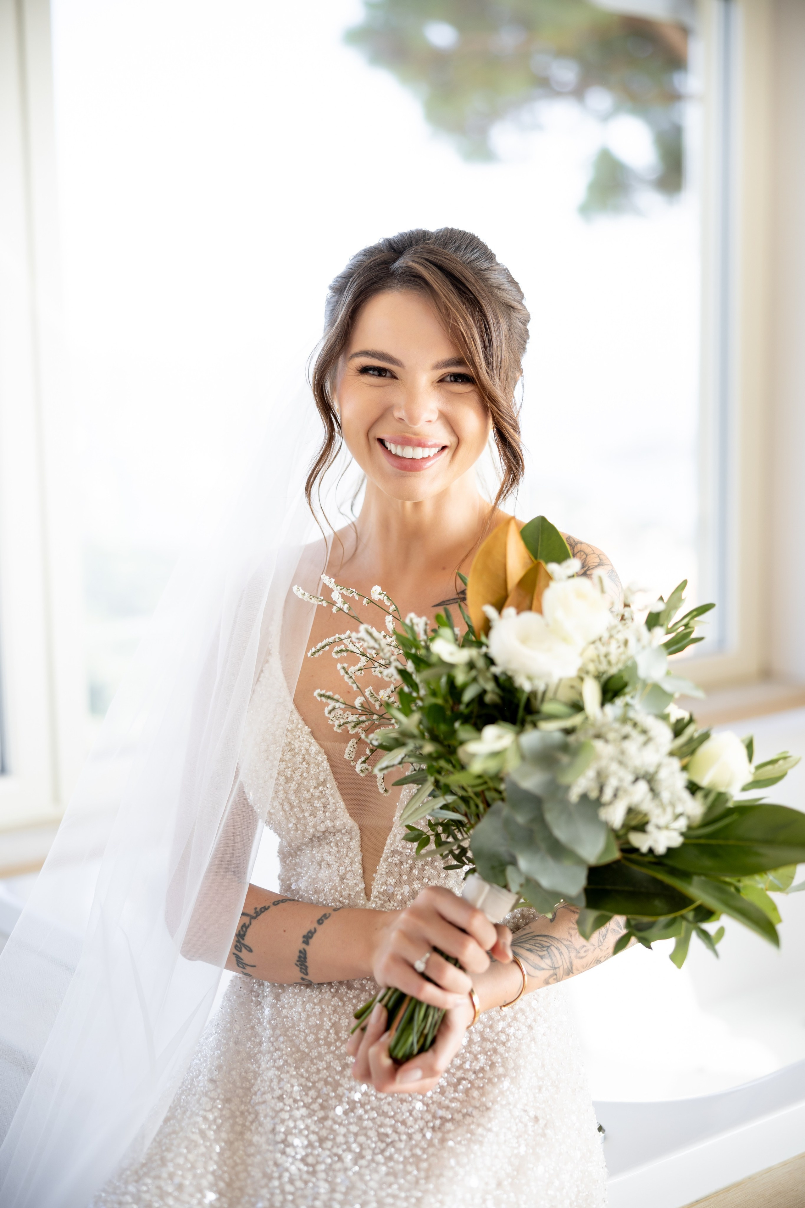 Classic bridal updo with natural makeup finish