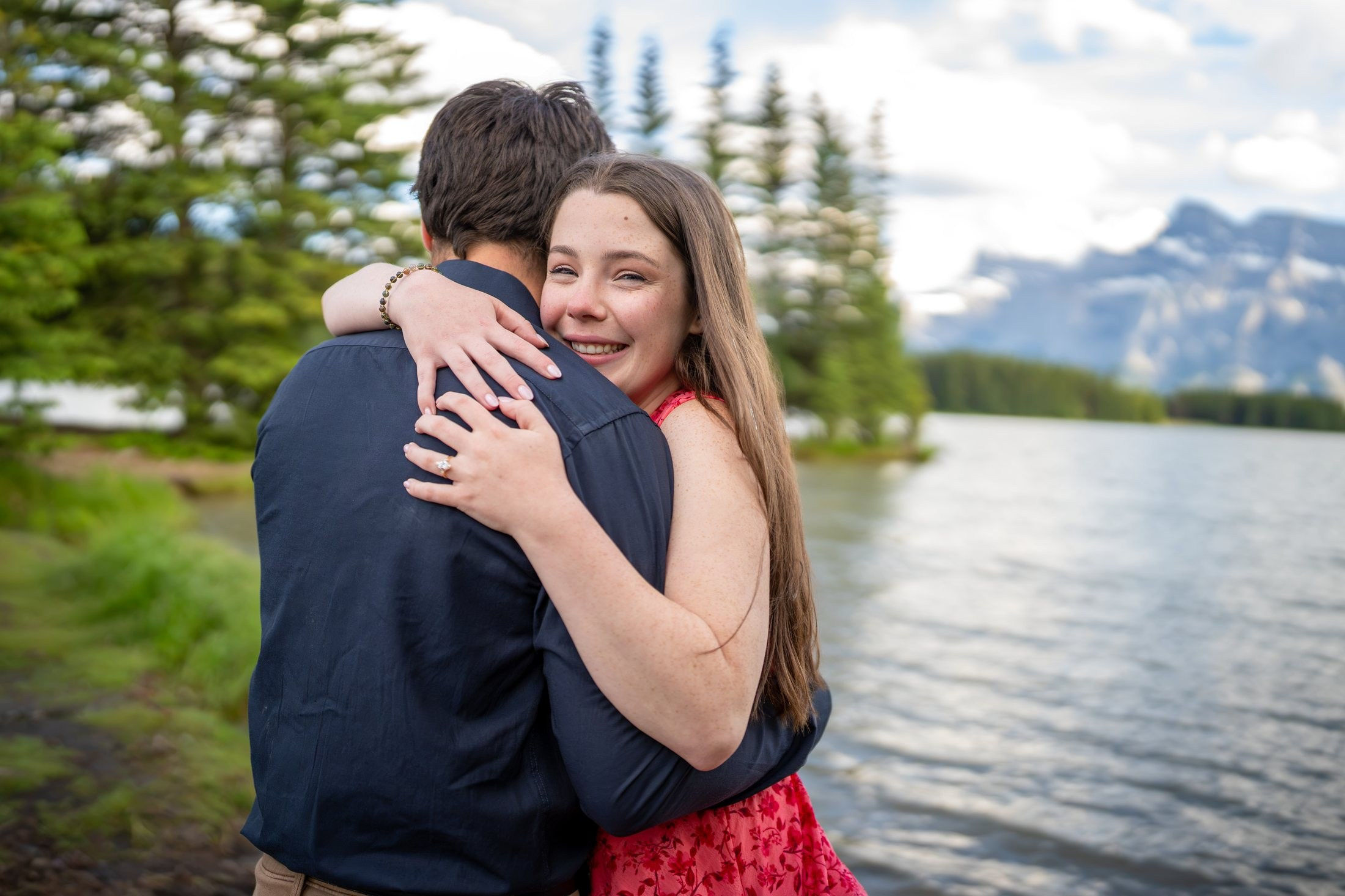 Family at a Rockies lake at golden hour