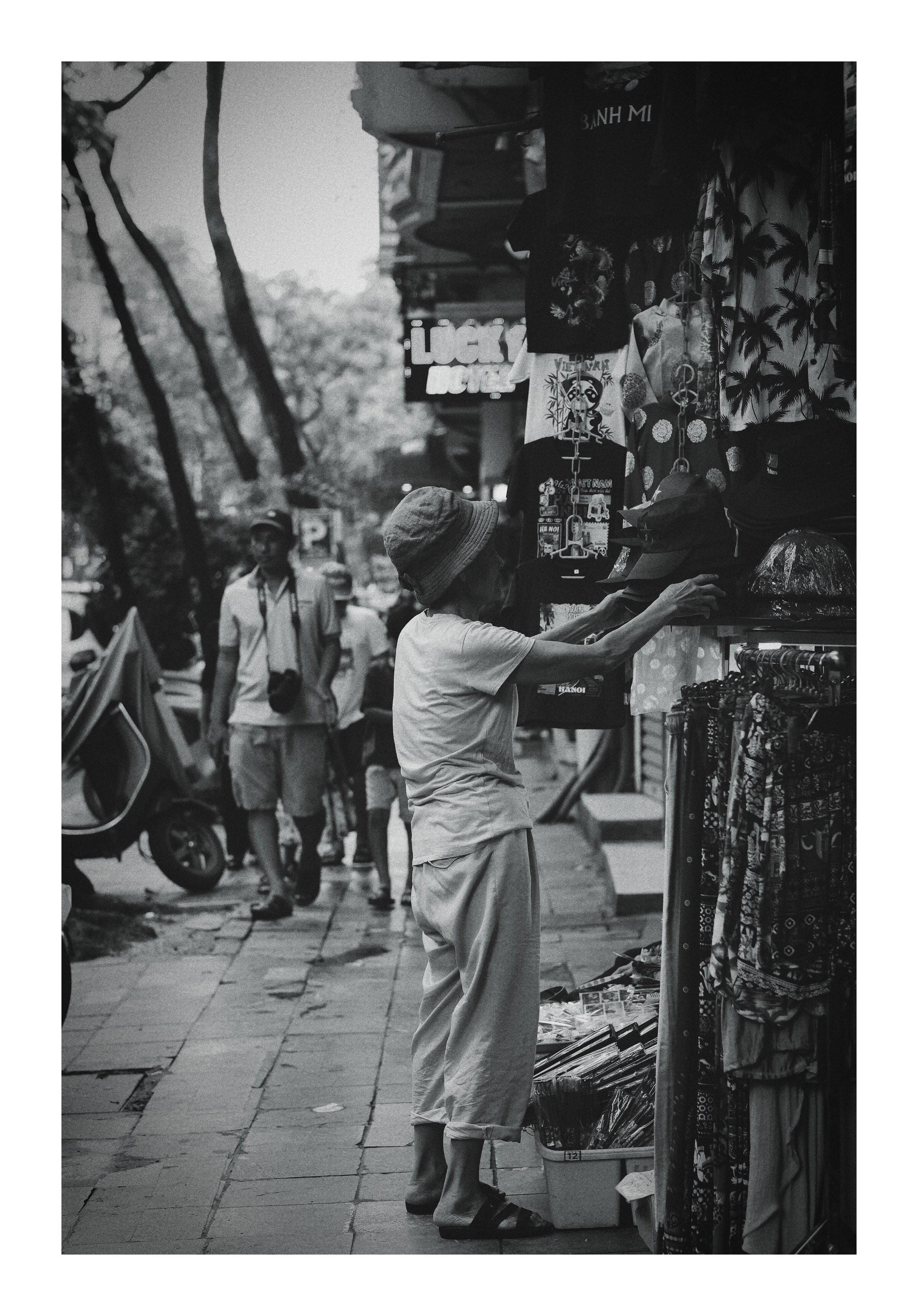 Black and White Photo Old Woman Vendor Hanoi Old Quarter