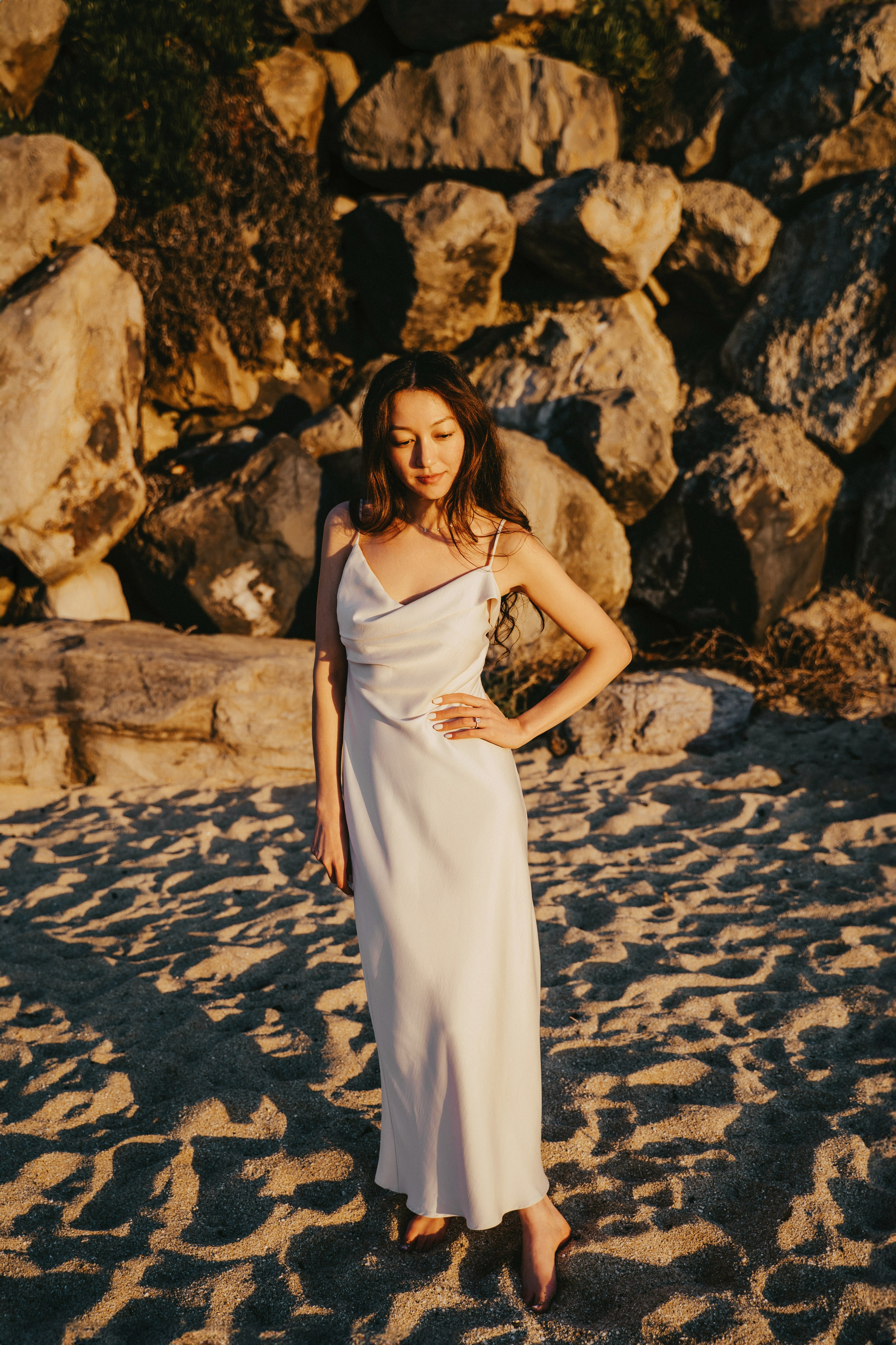 A photo shoot on the San Francisco beach at sunset. Engagement session. 