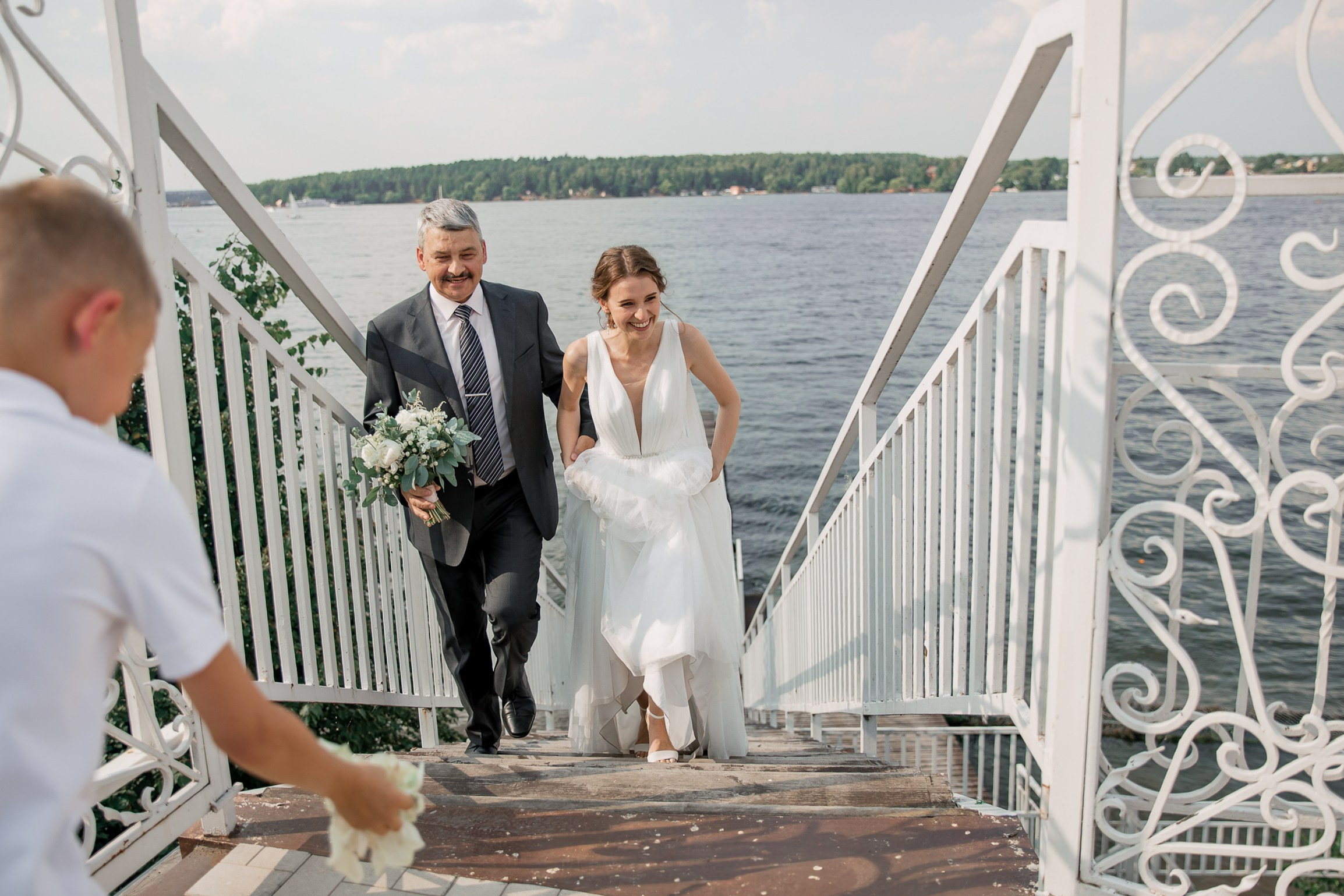 Bride walking to ceremony, by Bude, Cornwall reportage wedding photographer.