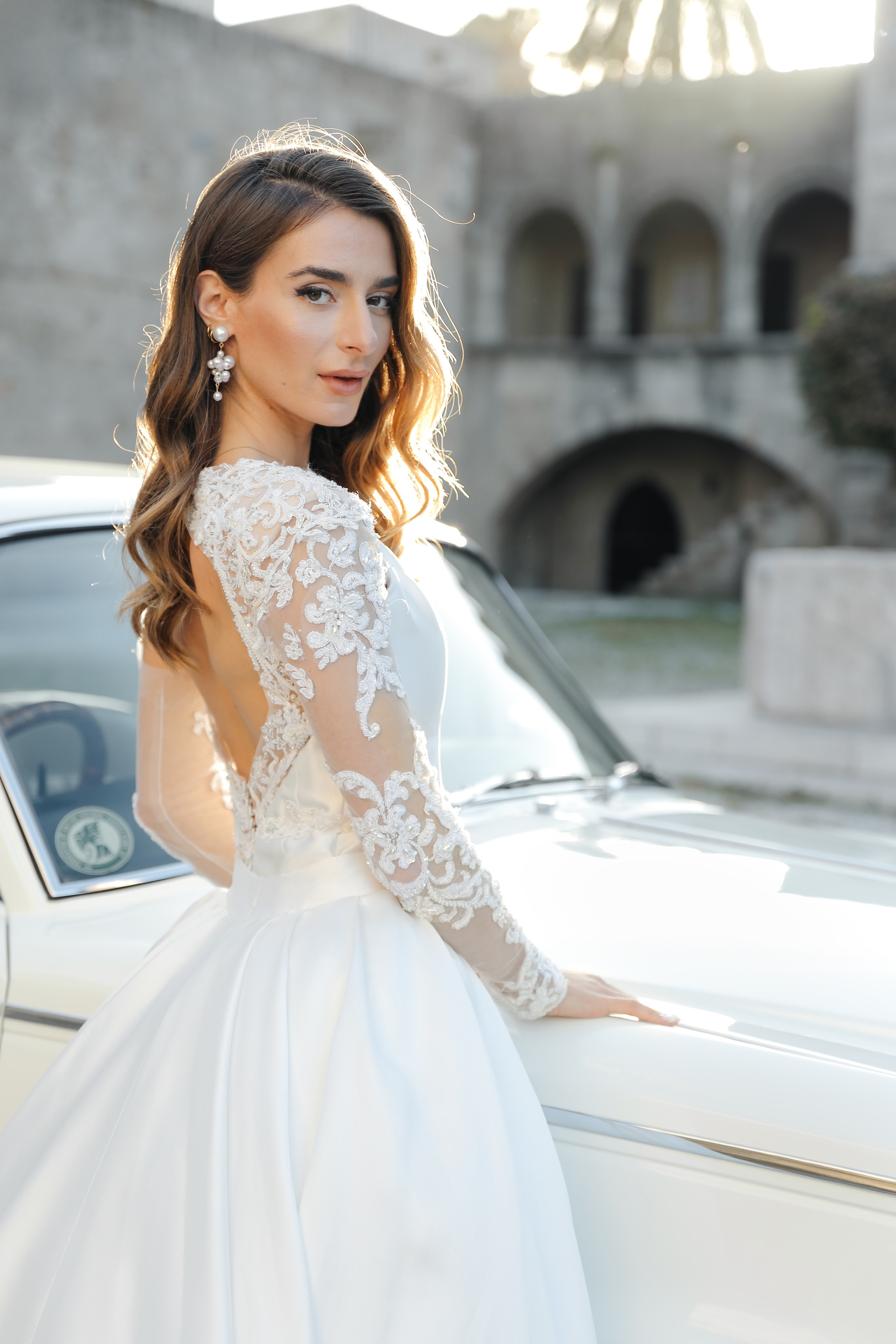 A bride next to Rolls Royce in old town of Rhodes island, Greece